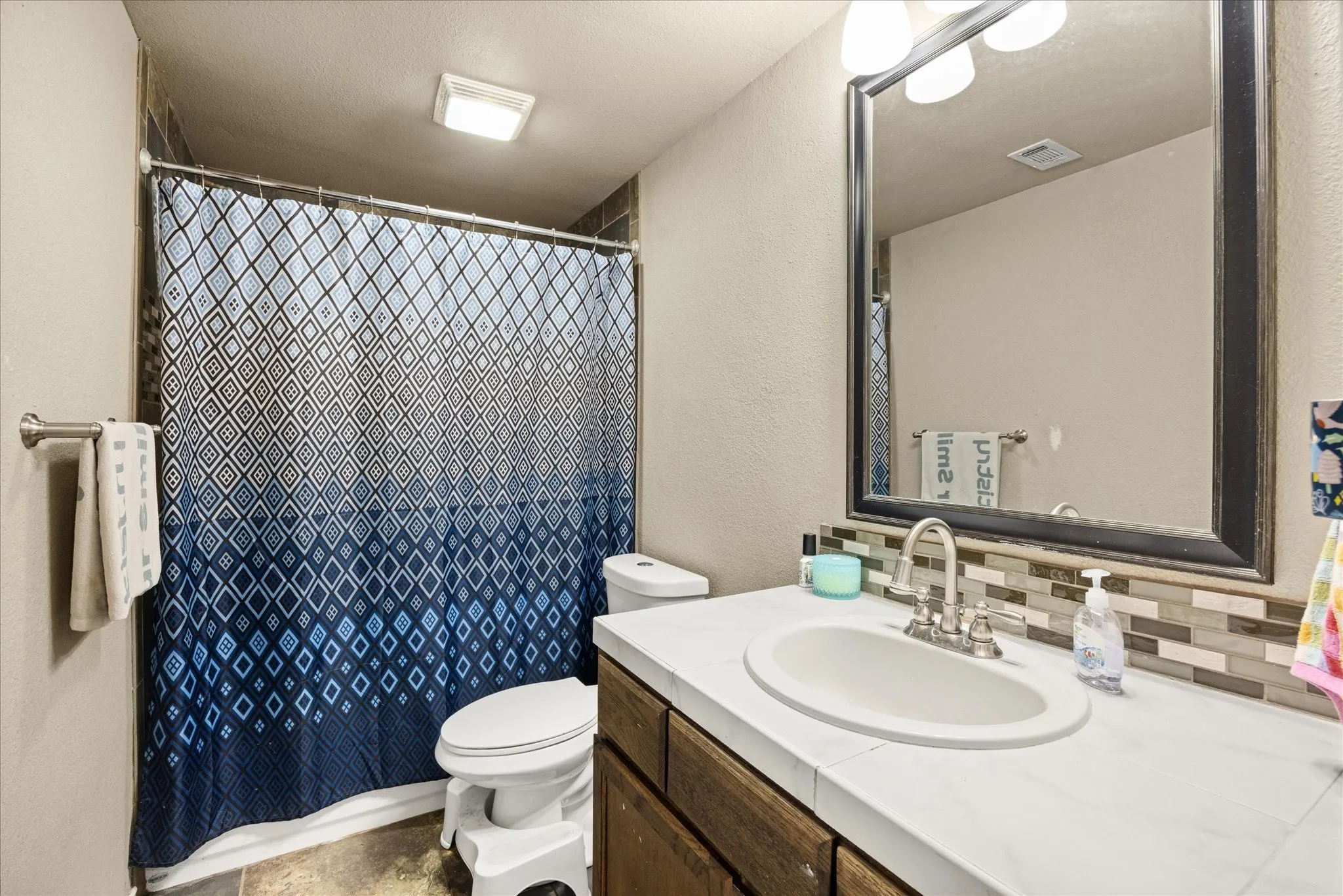 Main level bathroom for guests and serves on bedroom.