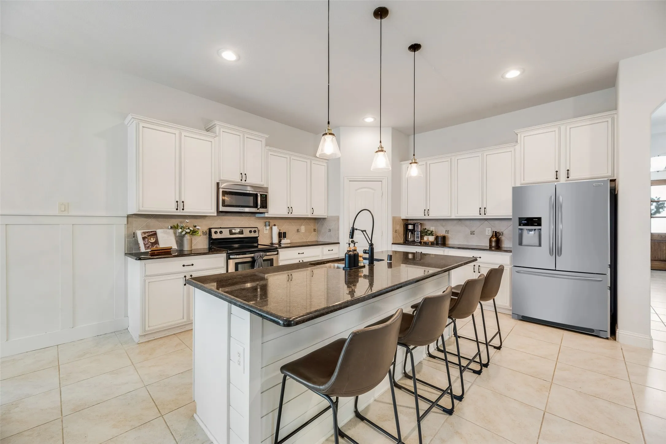L-shaped kitchen with plenty of cabinets for storage