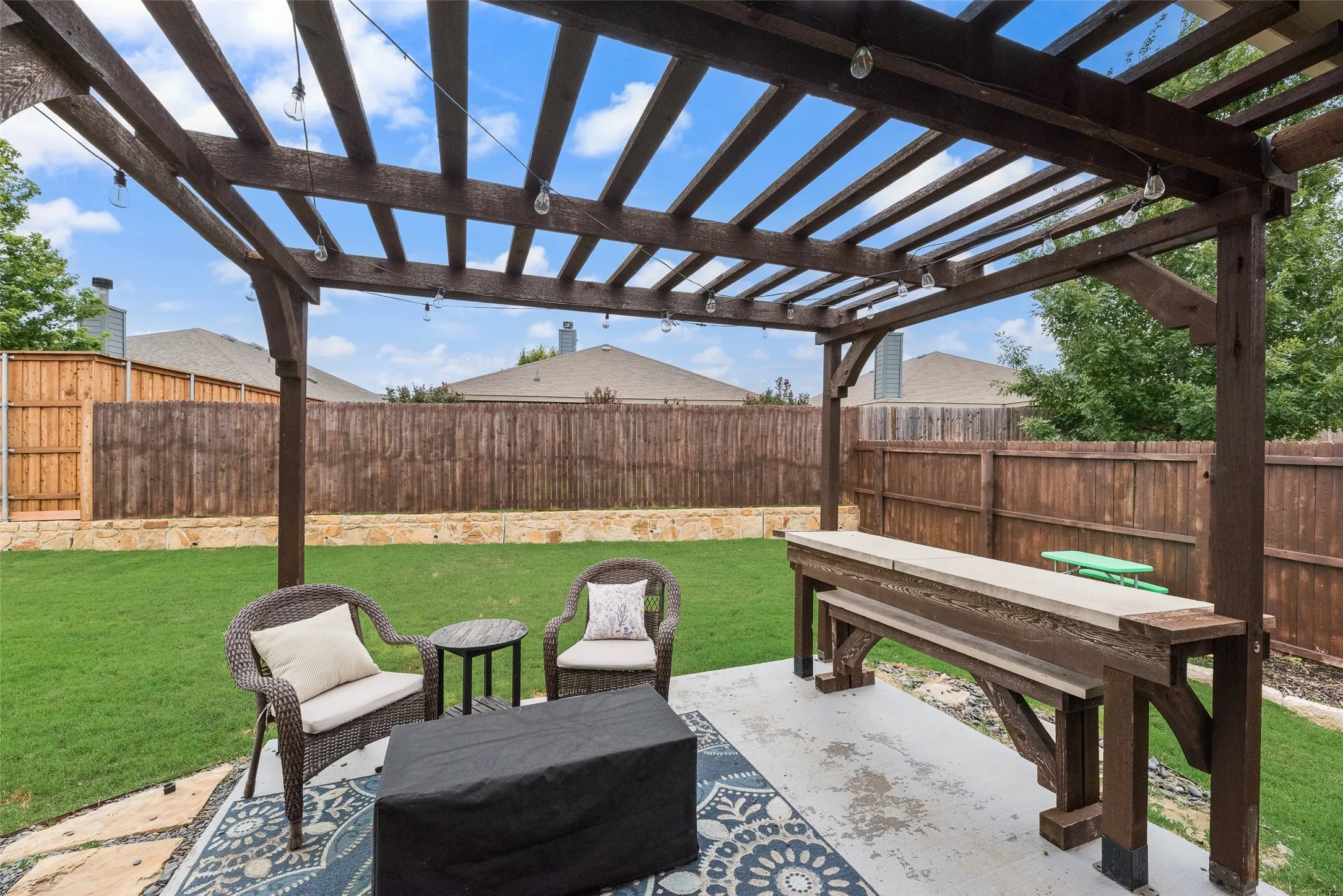 Backyard pergola and built-in table