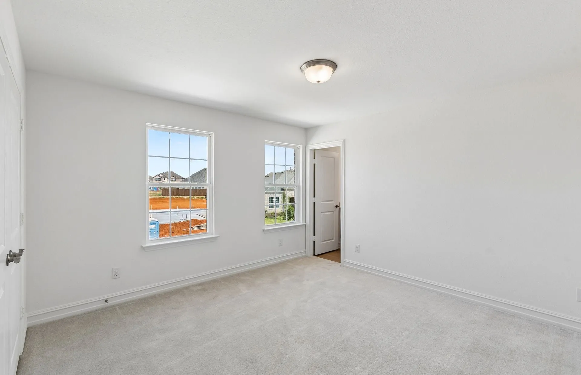 Secondary bedroom with large windows