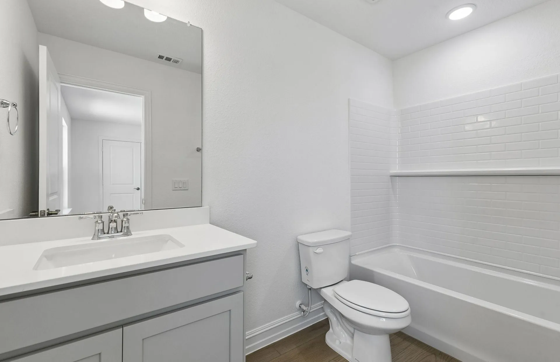Secondary bath with tile surrounded shower