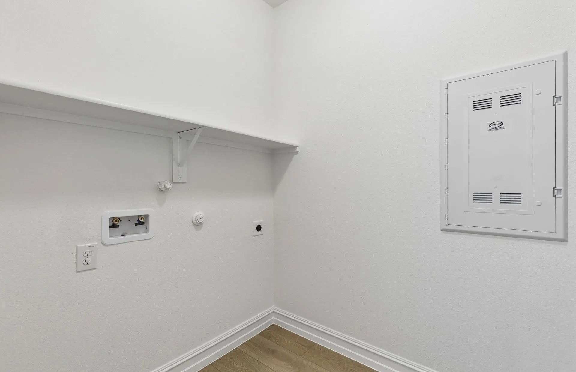 Laundry room with built-in shelving