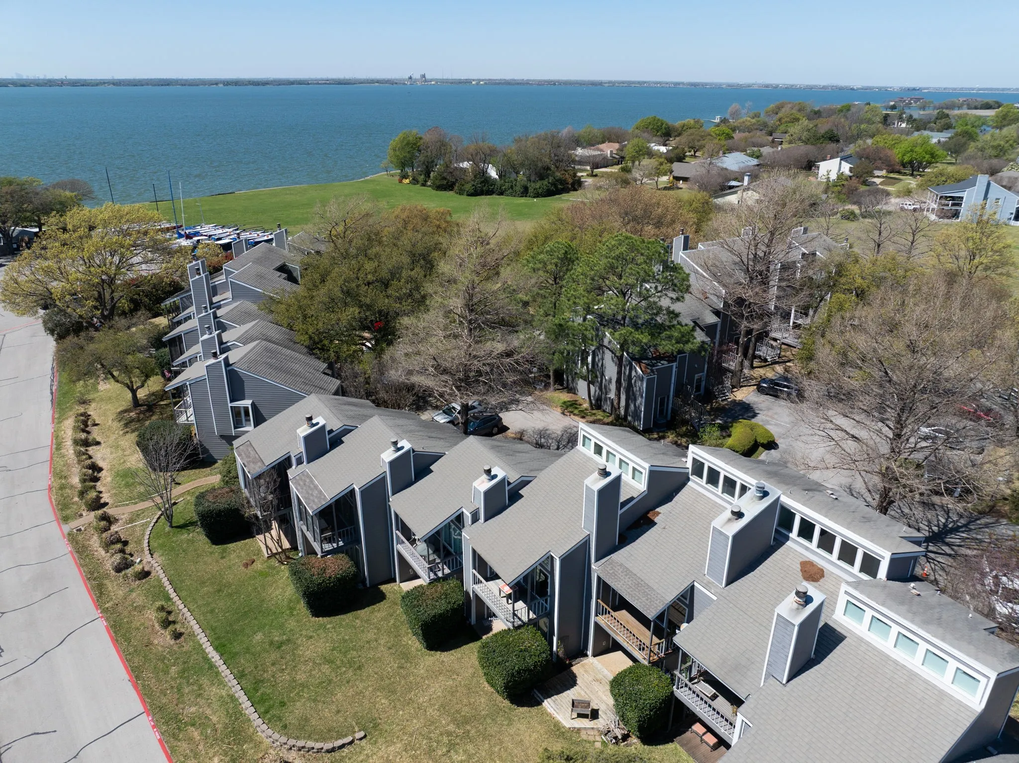 Waterfront residences featuring a serene lake backdrop