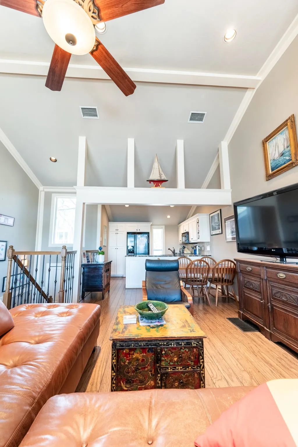 Vaulted ceilings with a ceiling fan and recessed lighting