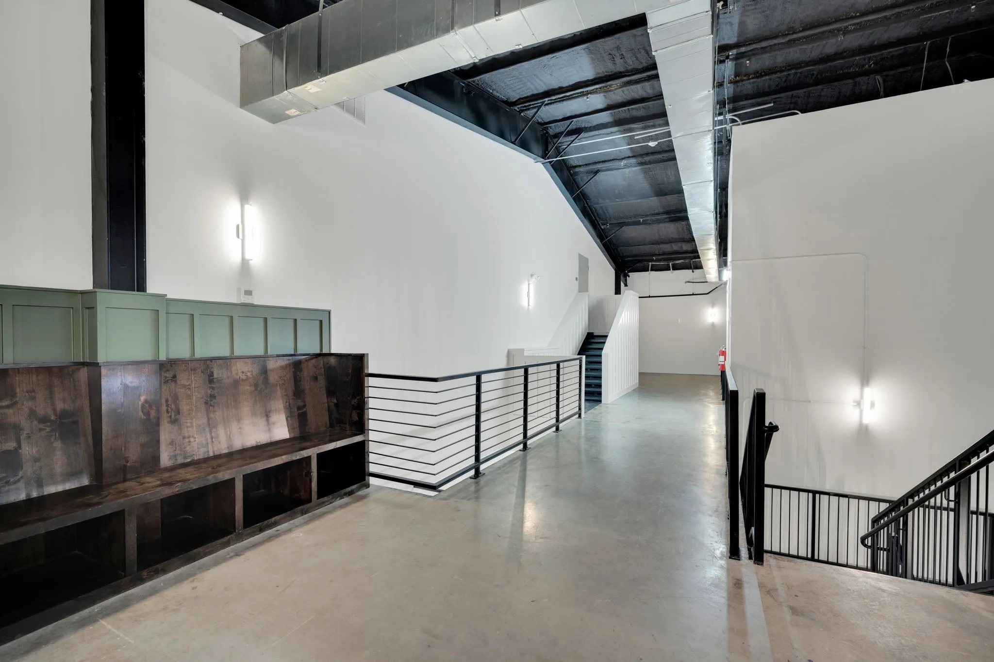 Expansive open interior with polished concrete flooring and exposed ductwork