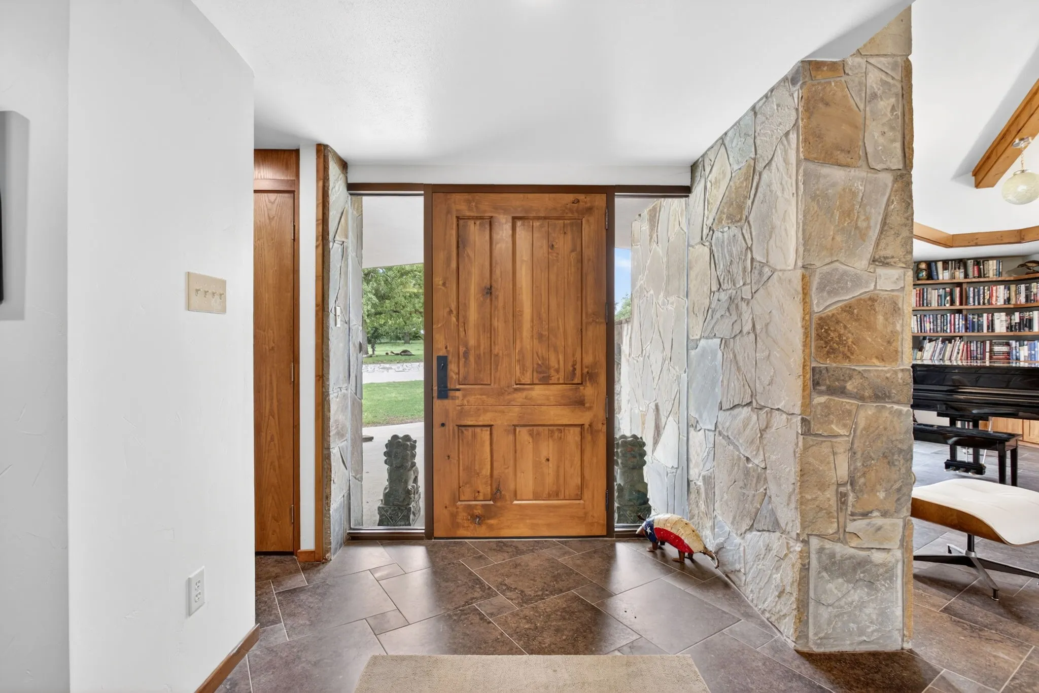 Solid wood-panel entry door with sidelight windows