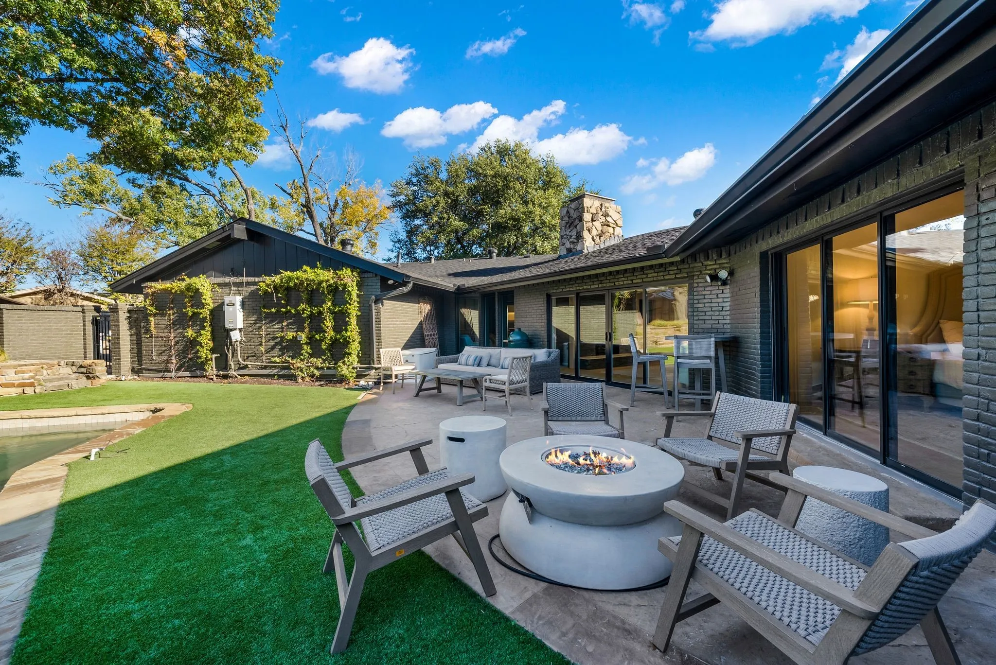 View of patio / terrace with an outdoor living space with a fire pit