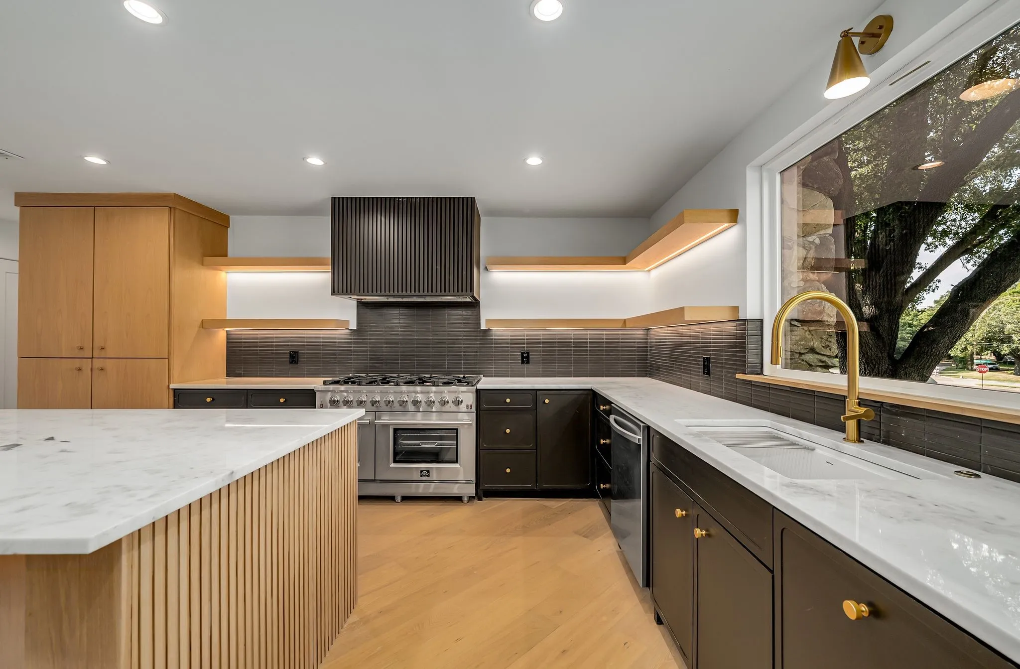 Kitchen with open shelves, light stone countertops, stainless steel appliances, light wood-style flooring, and recessed lighting