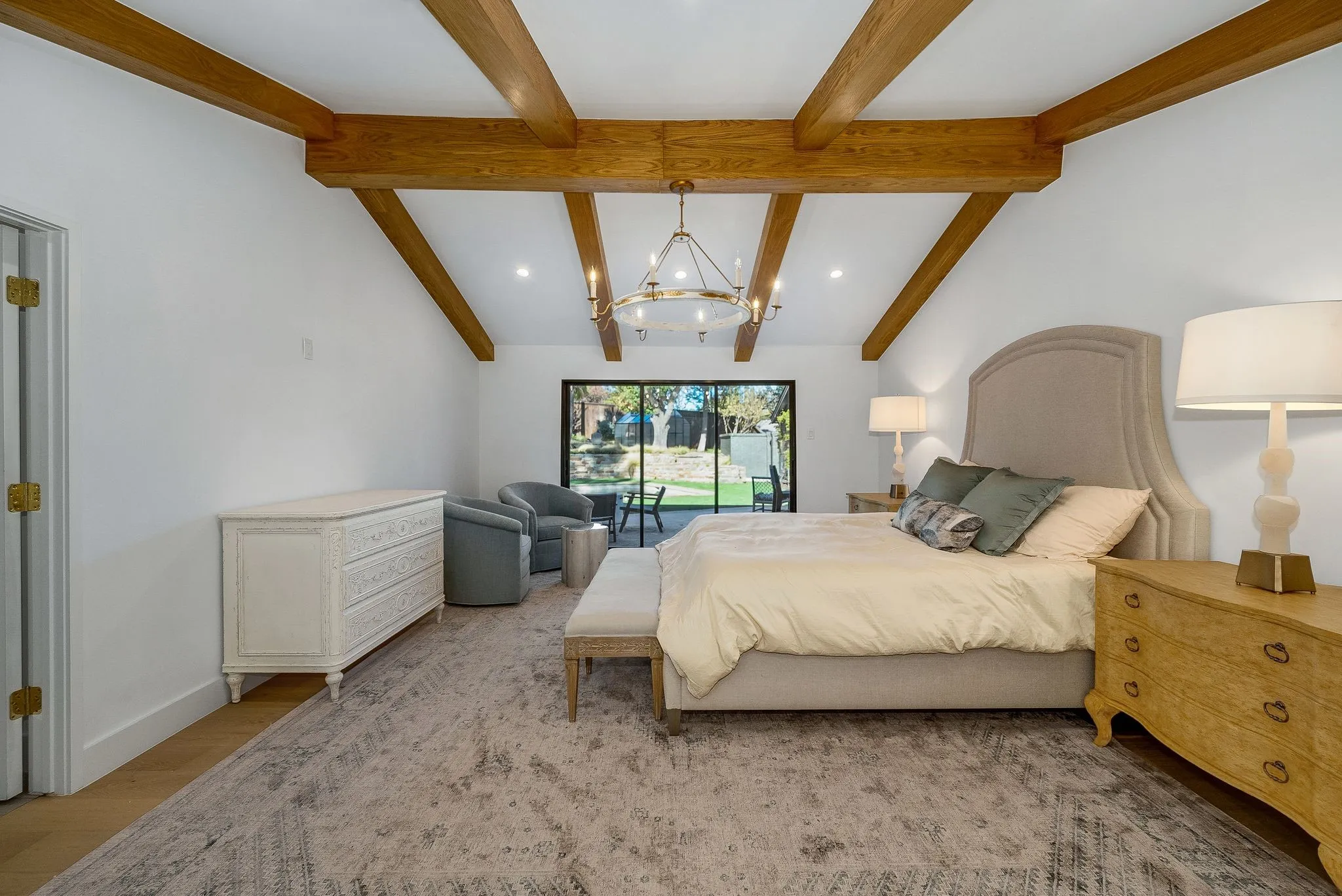 Bedroom with a chandelier and light wood-style floors