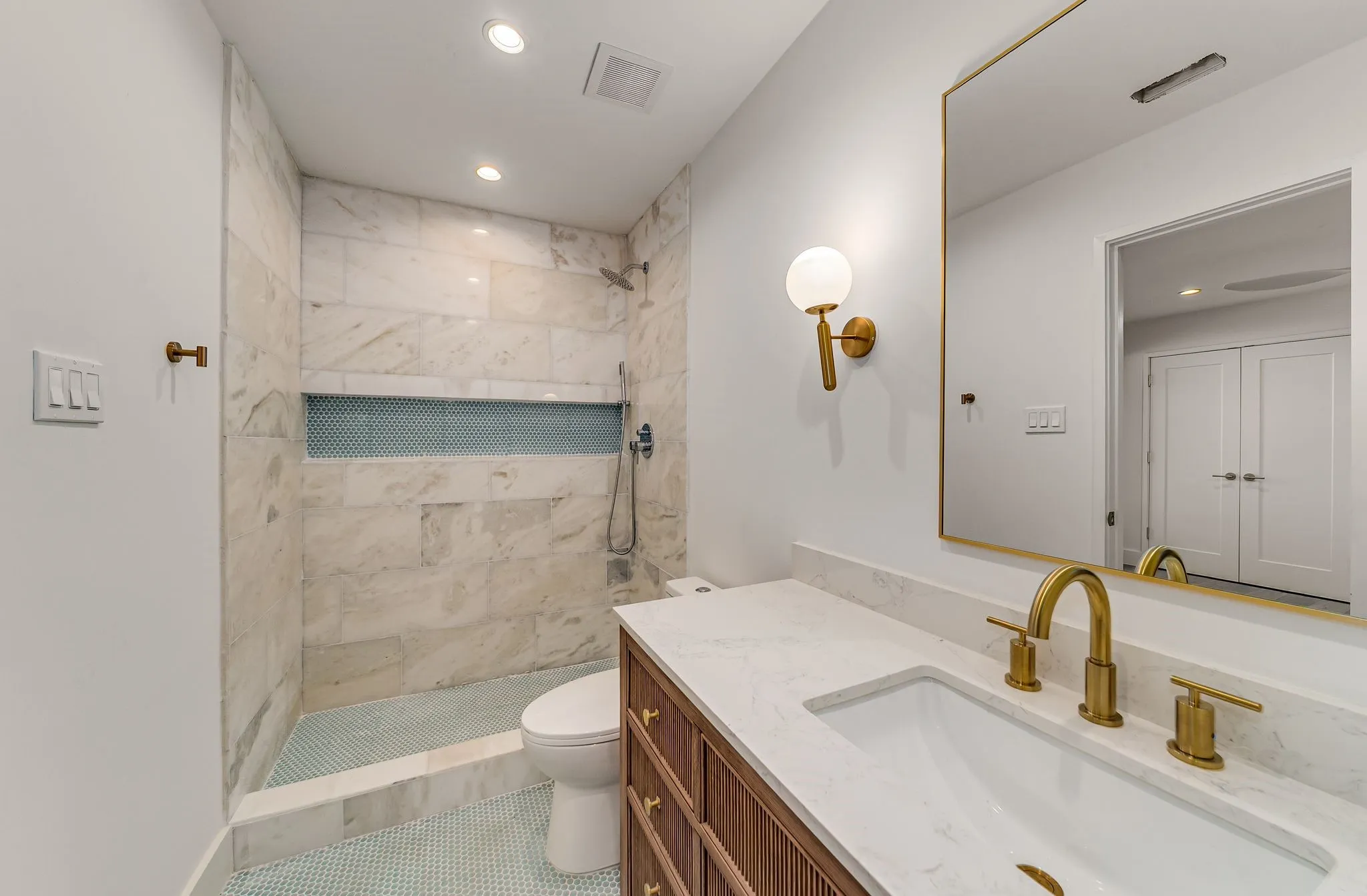 Full bath with vanity, a shower stall, recessed lighting, and tile patterned floors