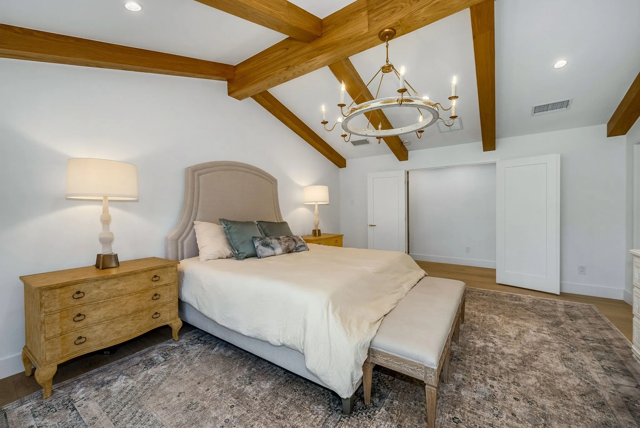 Bedroom with a chandelier, recessed lighting, and light wood-style flooring