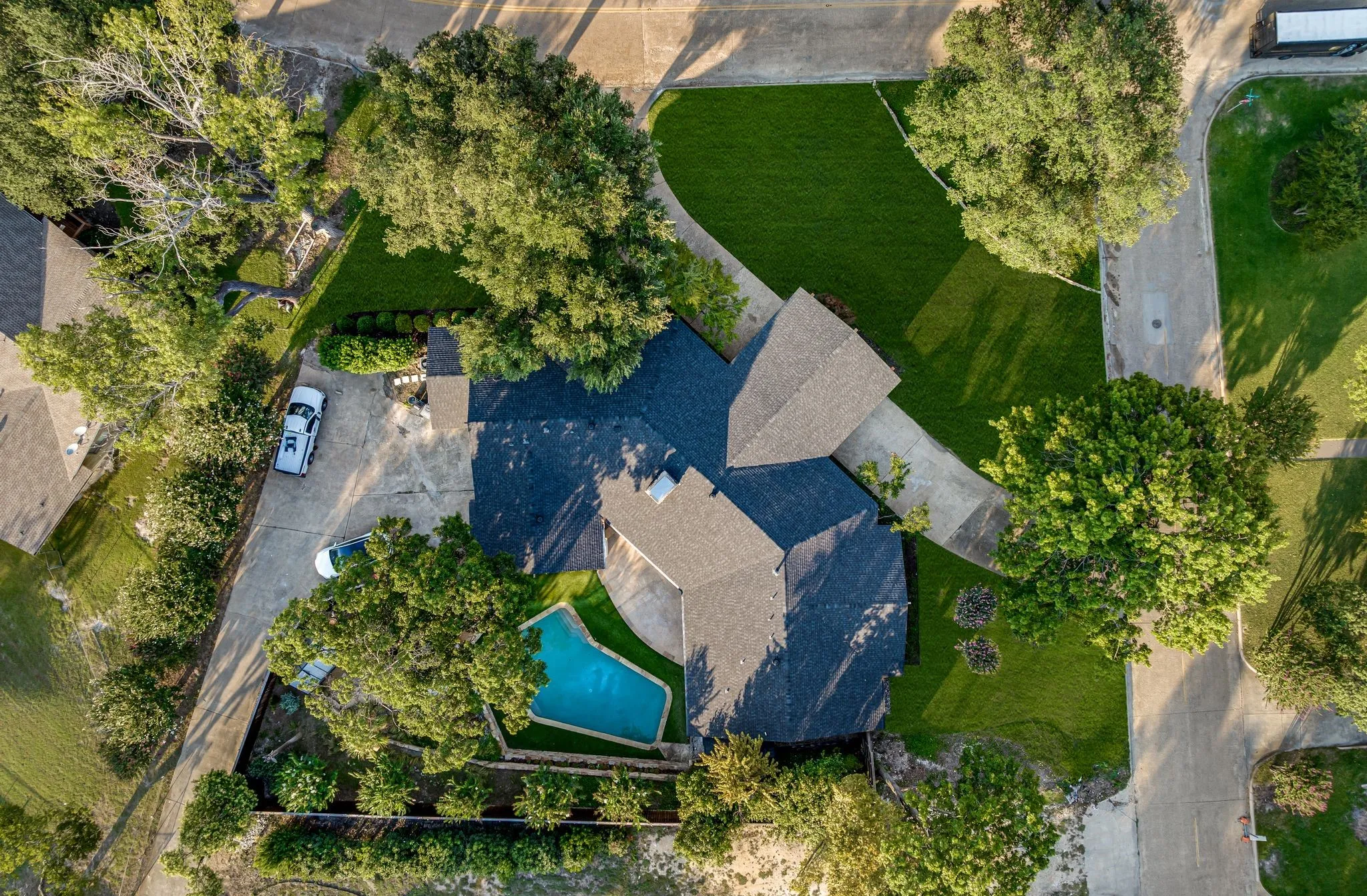 Aerial view of property and surrounding area with a pool