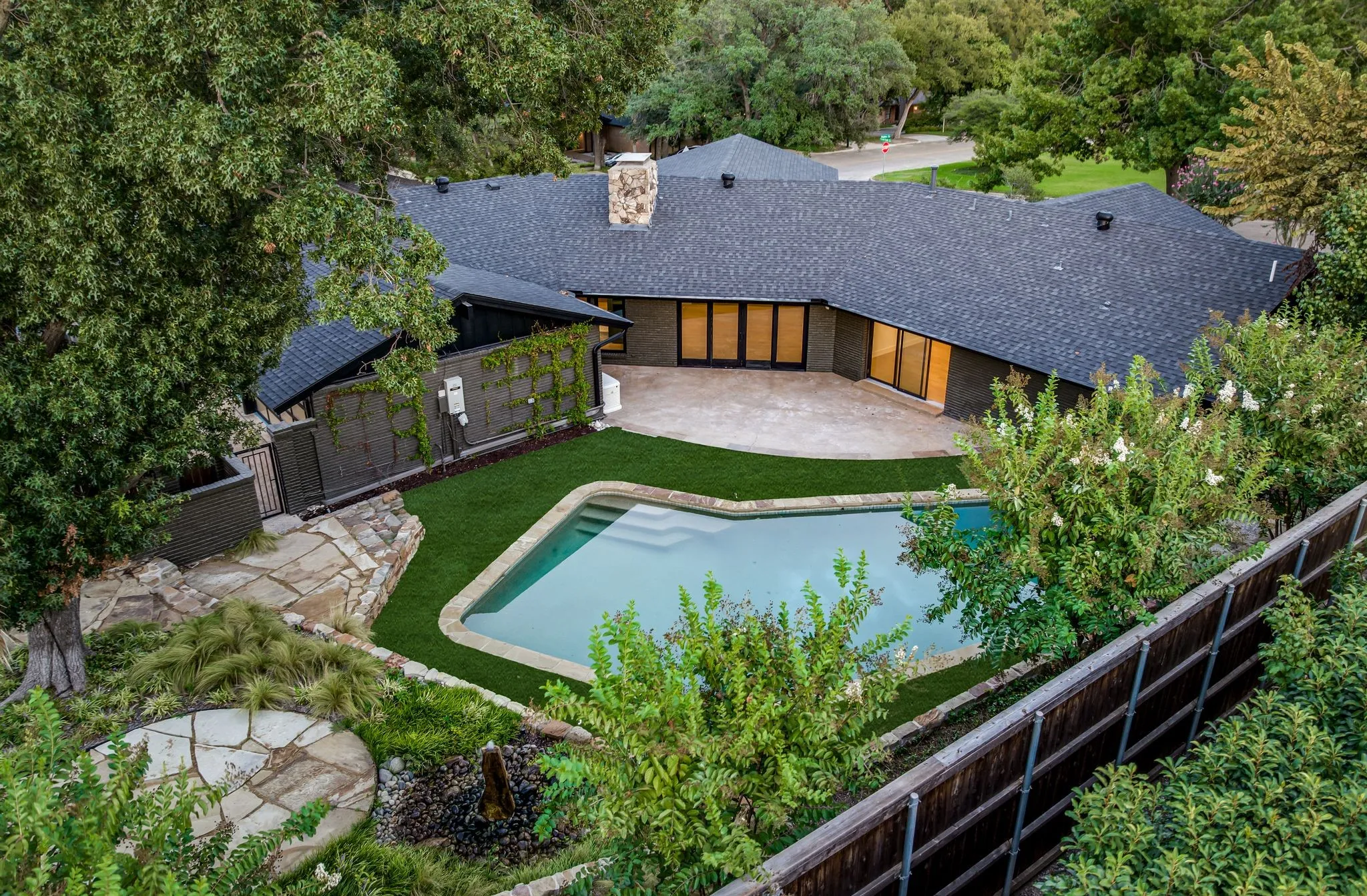 View of swimming pool with a patio area and a fenced backyard