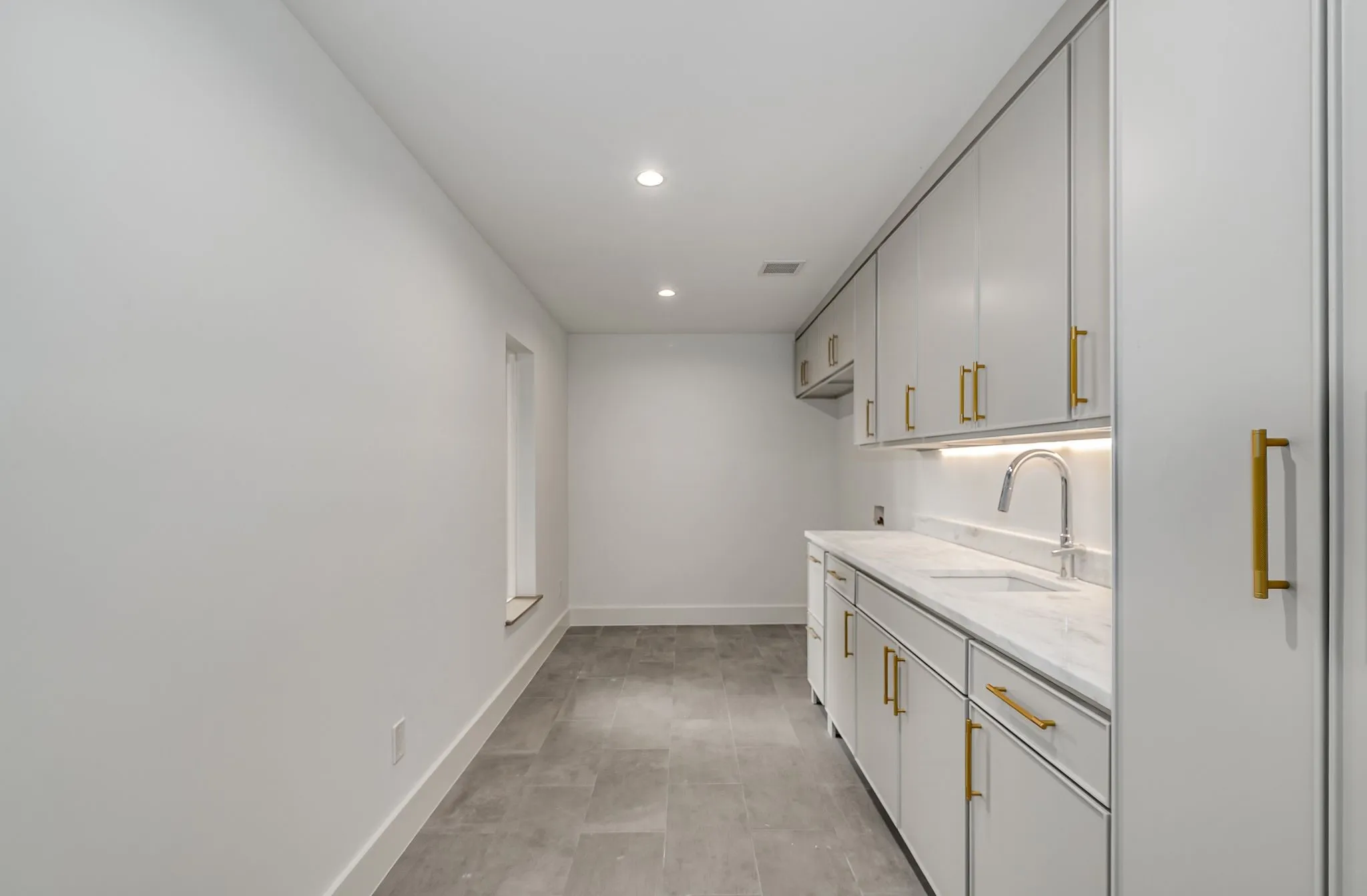 Laundry room featuring cabinet space, recessed lighting, and hookup for a washing machine