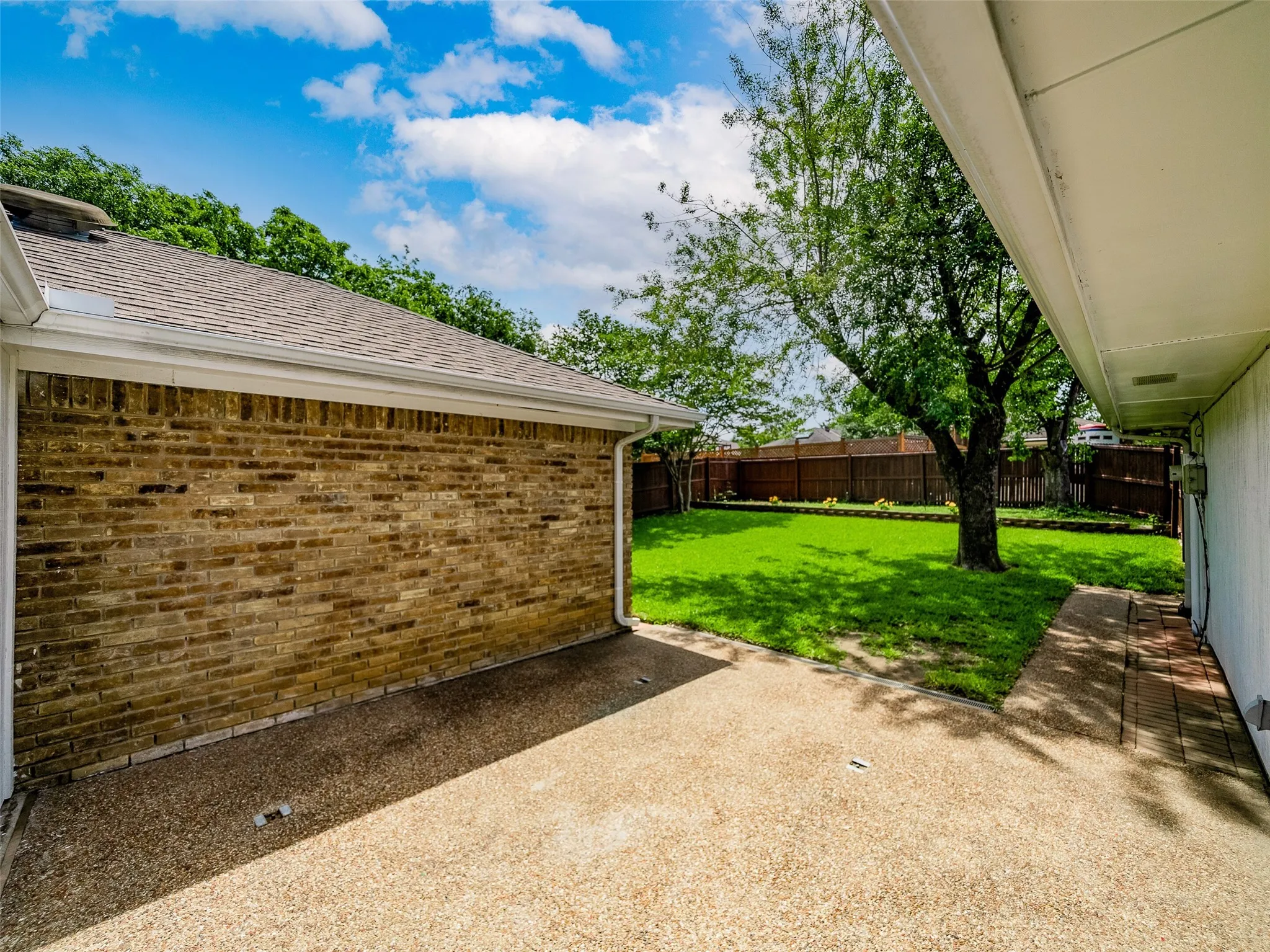 At the end of the patio is a built-in drain that takes water to the side of the property, around the house, and then down to the front of the street.