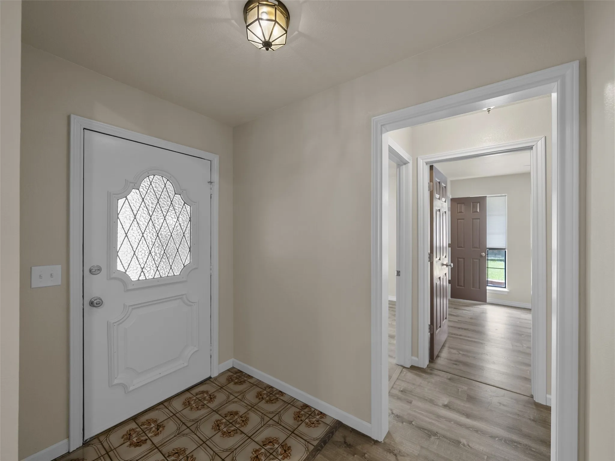 Off the entry with it's original charm of character in the front door and tile is a large walk-in closet.