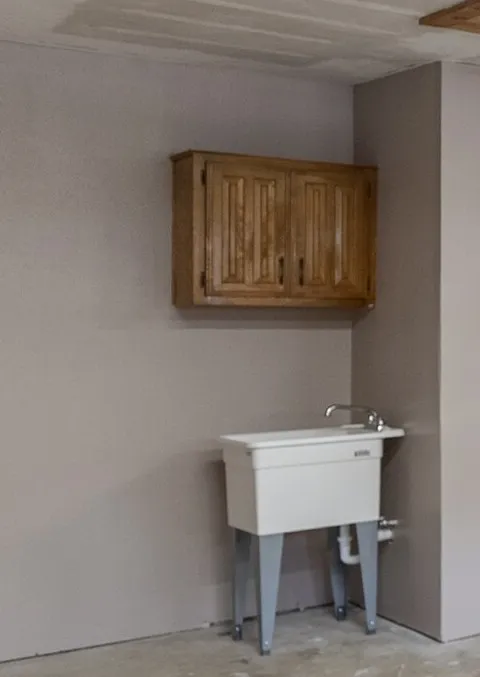 This is the sink that is located in the two car garage of the home.