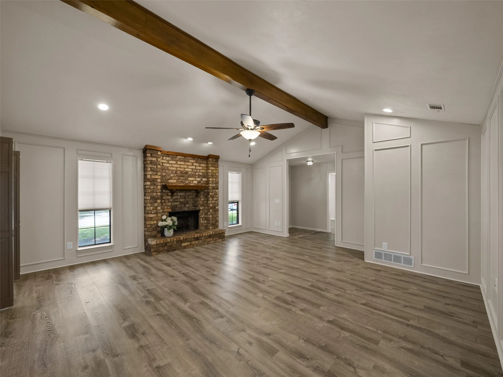 The owner has two complete boxes of matching vinyl plank flooring up in the attic for the new owner that convey with the home.