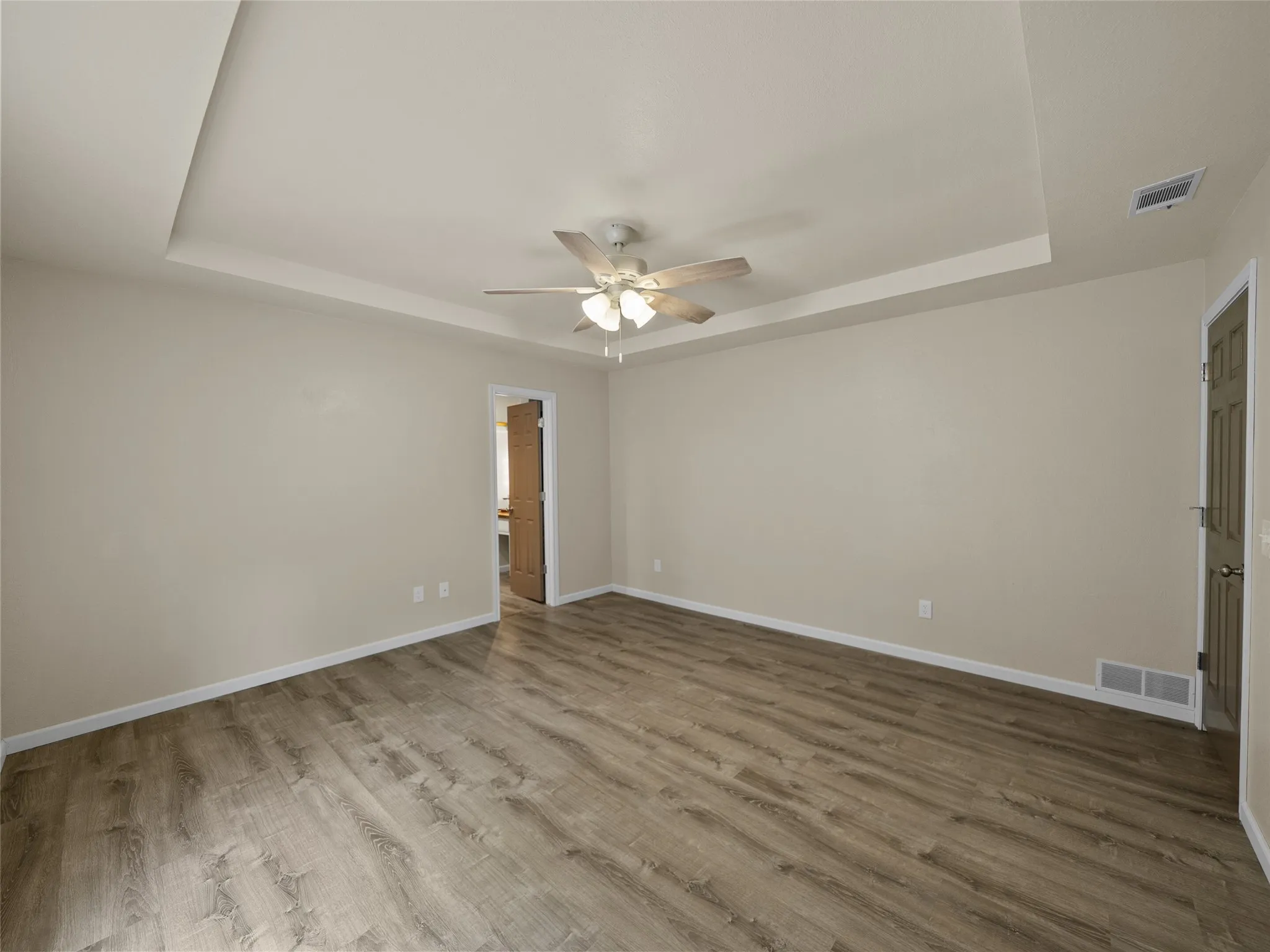 Master bedroom offers a boxed ceiling and is spacious with ensuite bath.