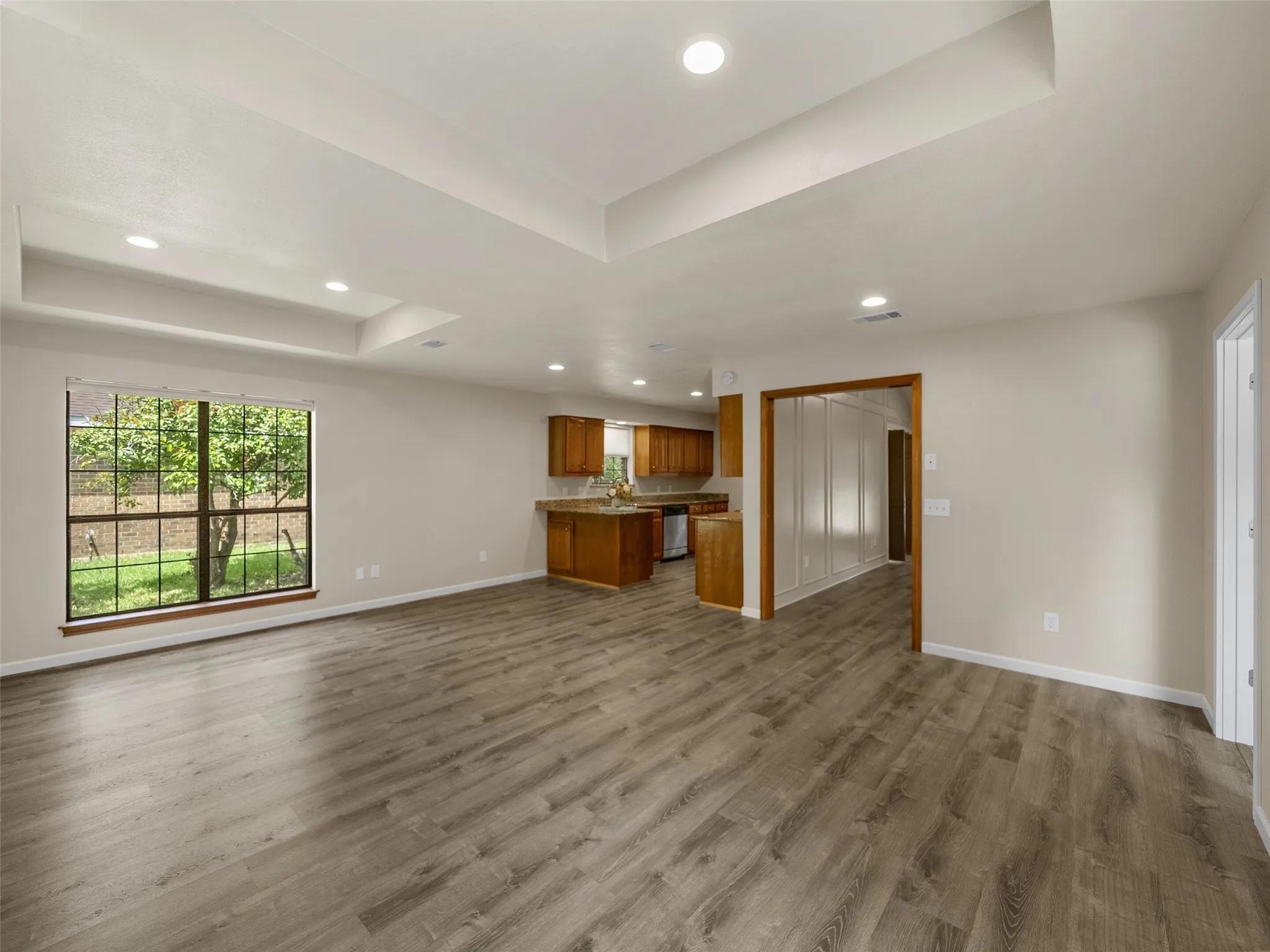 The game room and the breakfast nook area each feature box ceiling affects and are open to each other.