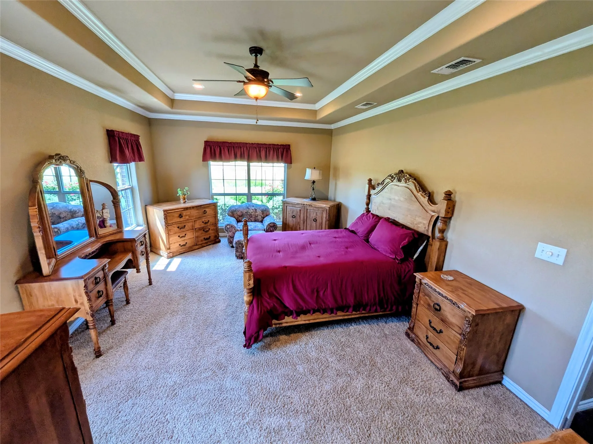 Master Suite taken from the entry of the master bath. Look at those big windows, beautiful view and amazing boxed ceiling with crown molding