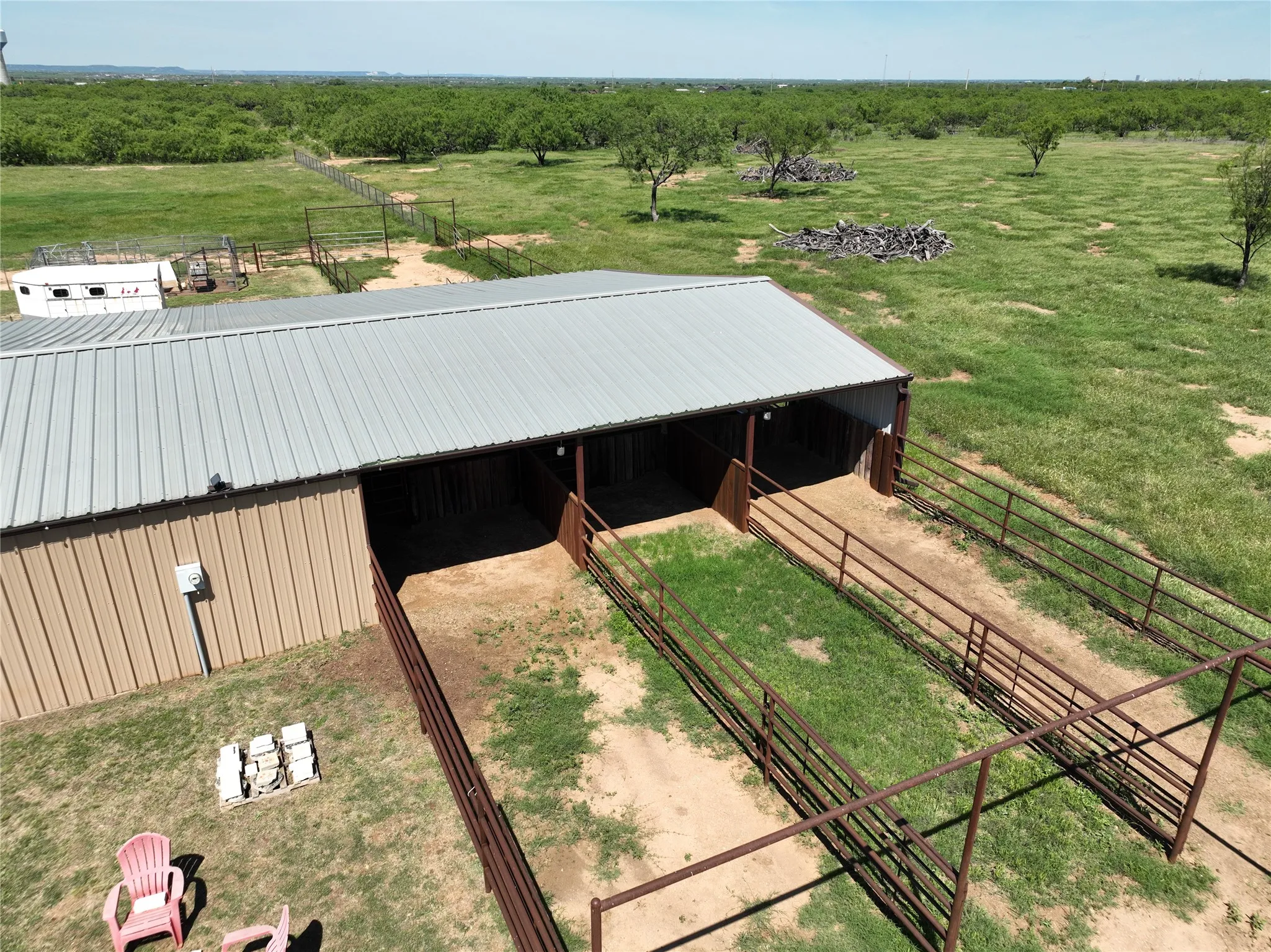 Overhead of barn showing pipe runs off one side (there are pipe runs off both sides). NOTE: GUTTERS to prevent puddling

