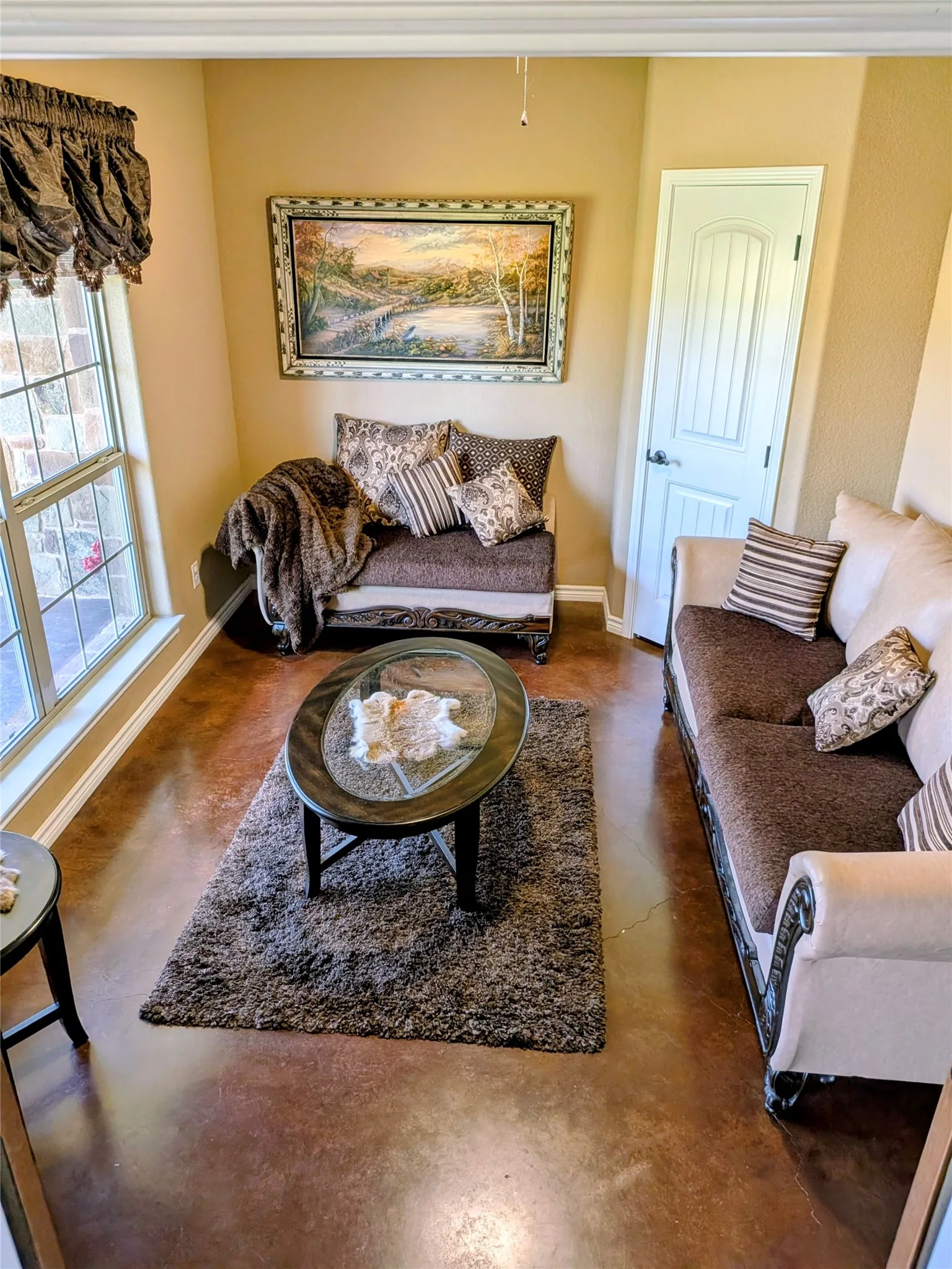 This is the 4th bedroom which could also be a sitting area or play area. It is on the left as you enter the foyer.