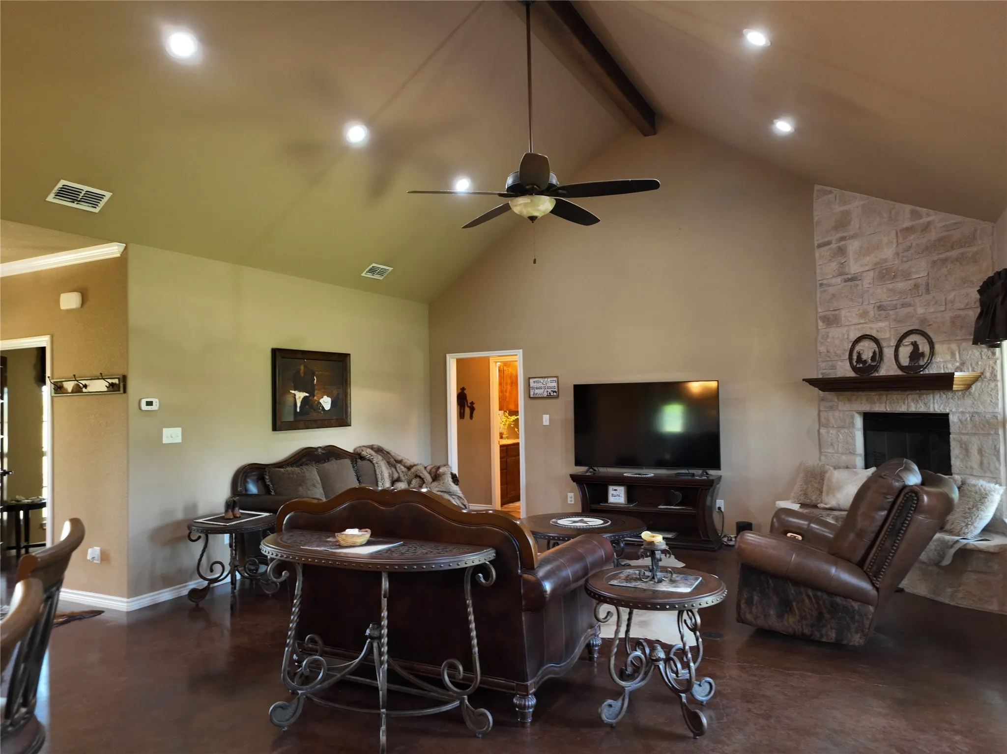 showing beautiful vaulted ceilings and stone fireplace