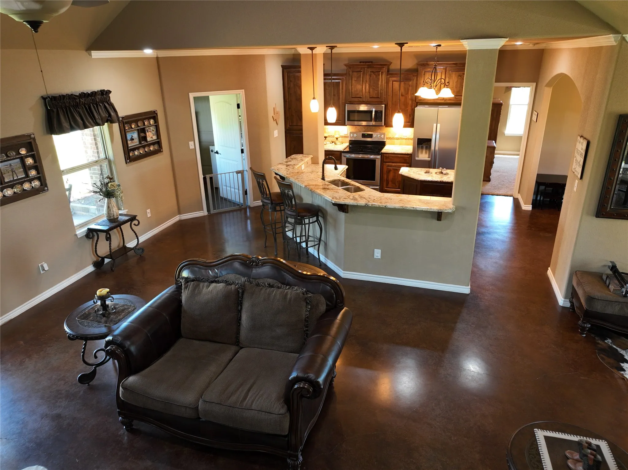 overhead of the breakfast and kitchen w-utility off to the left and dining room to the right. Master suite  is down the short hall