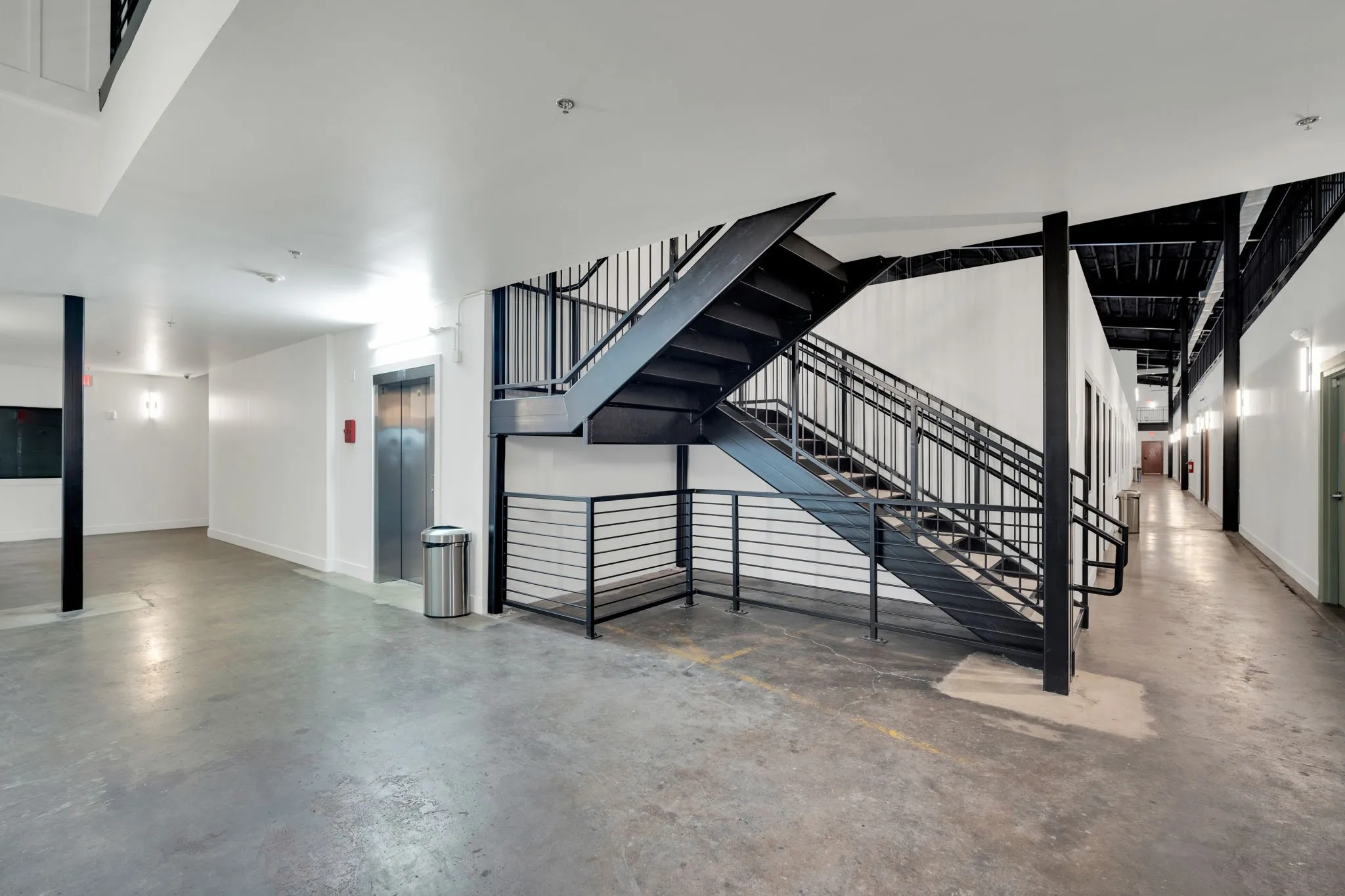 Industrial-style metal staircase with open risers and railing