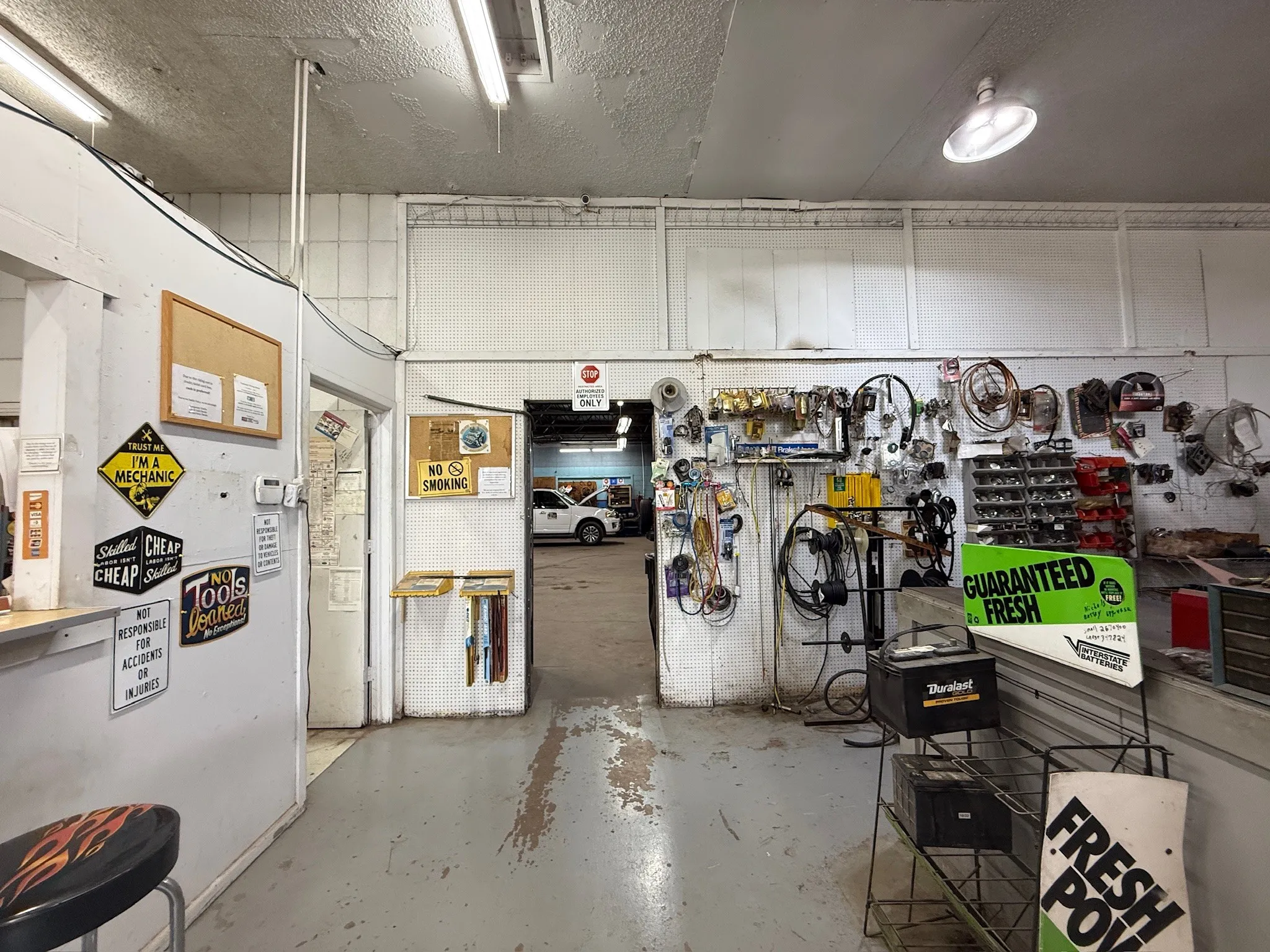 Commercial interior featuring fluorescent and surface-mounted ceiling lighting
