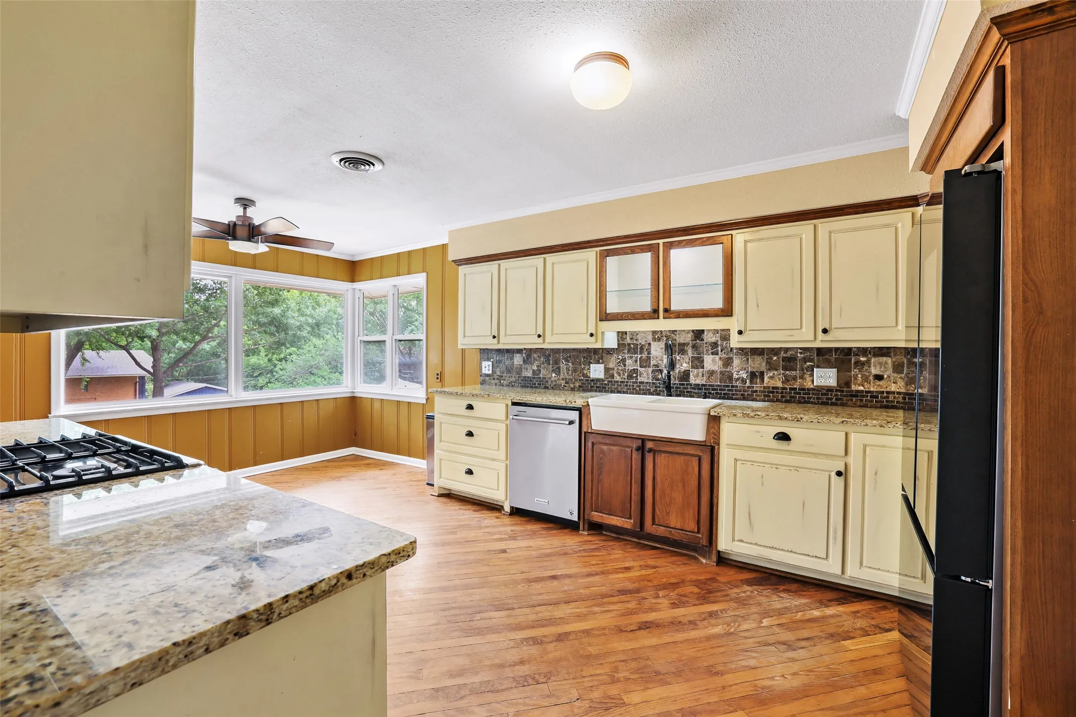 Oversized kitchen with original hardwood floors

