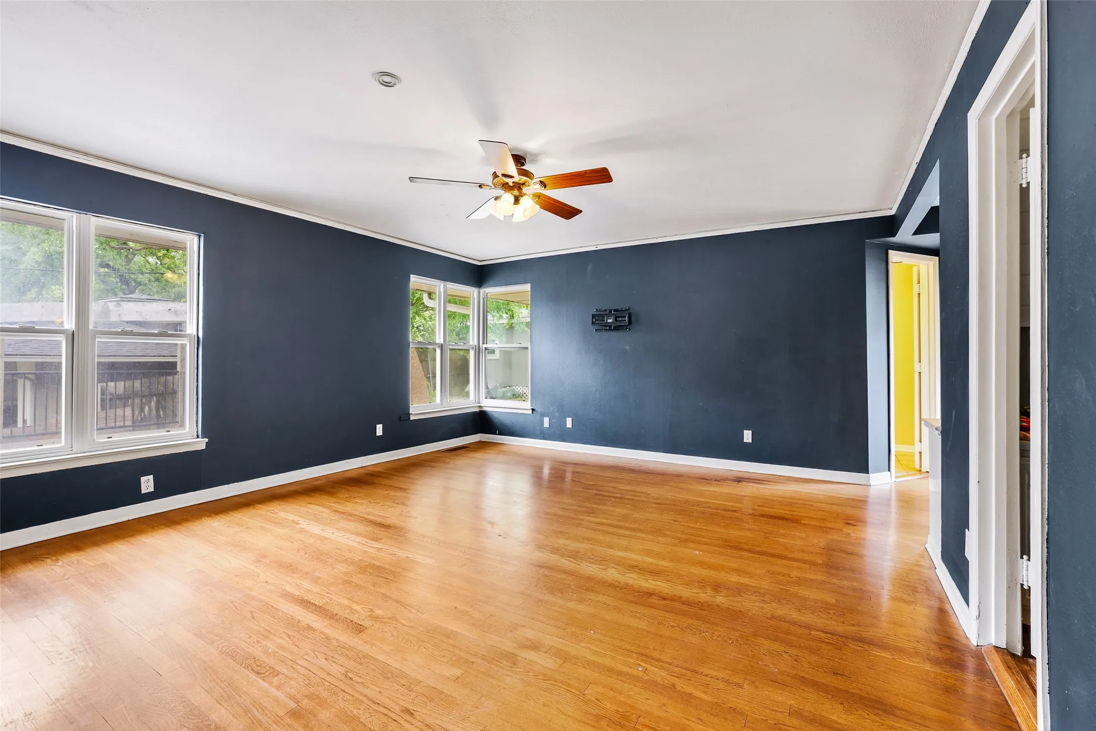 Original hardwood floors in primary bedroom