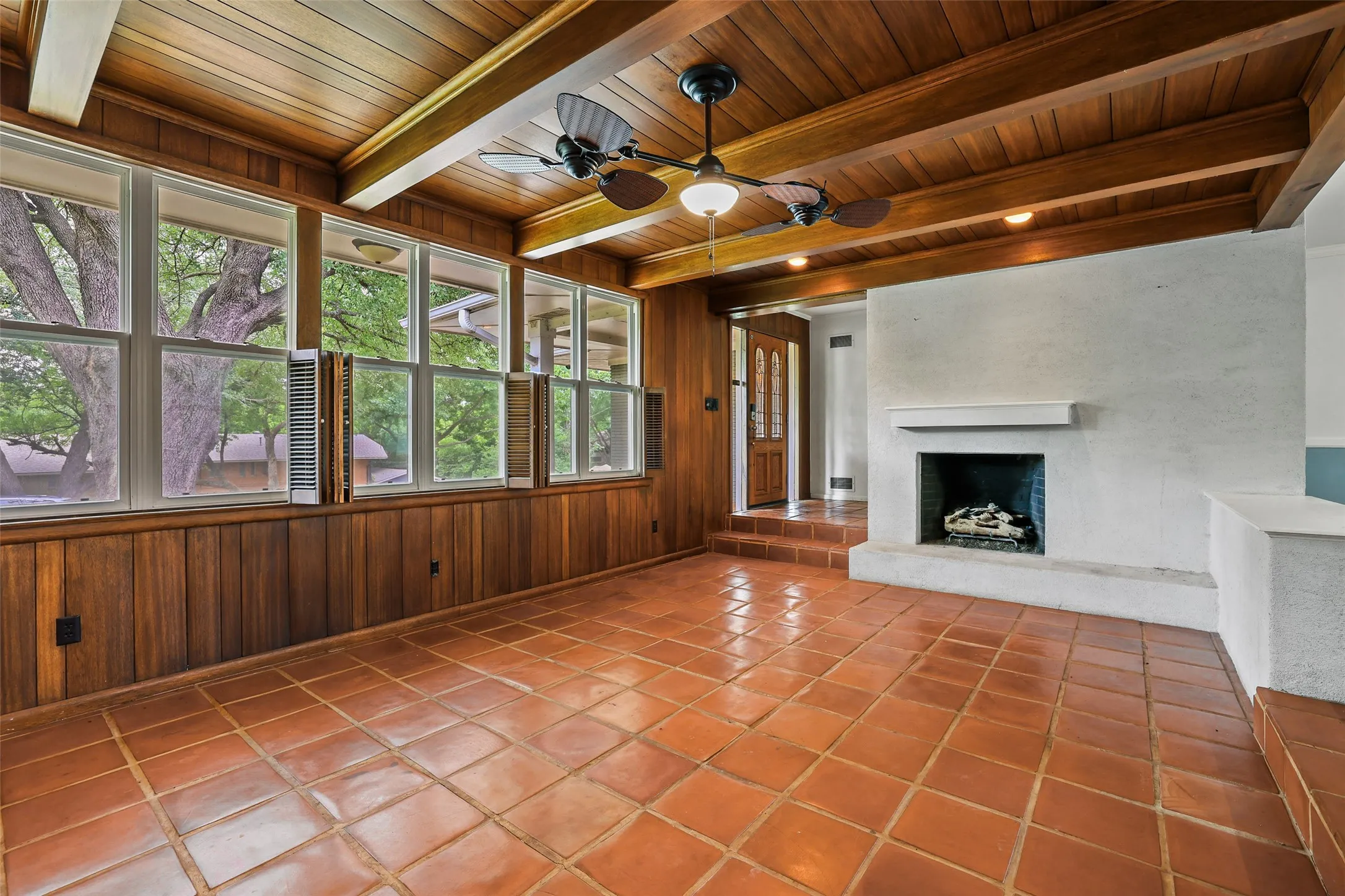 Cozy wood paneling warms up the living area