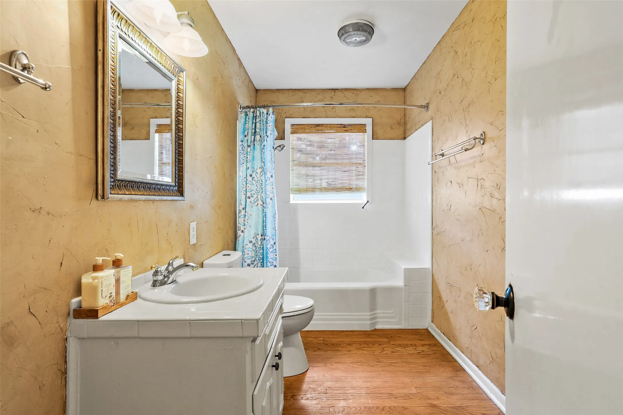 Full bathroom with original tub