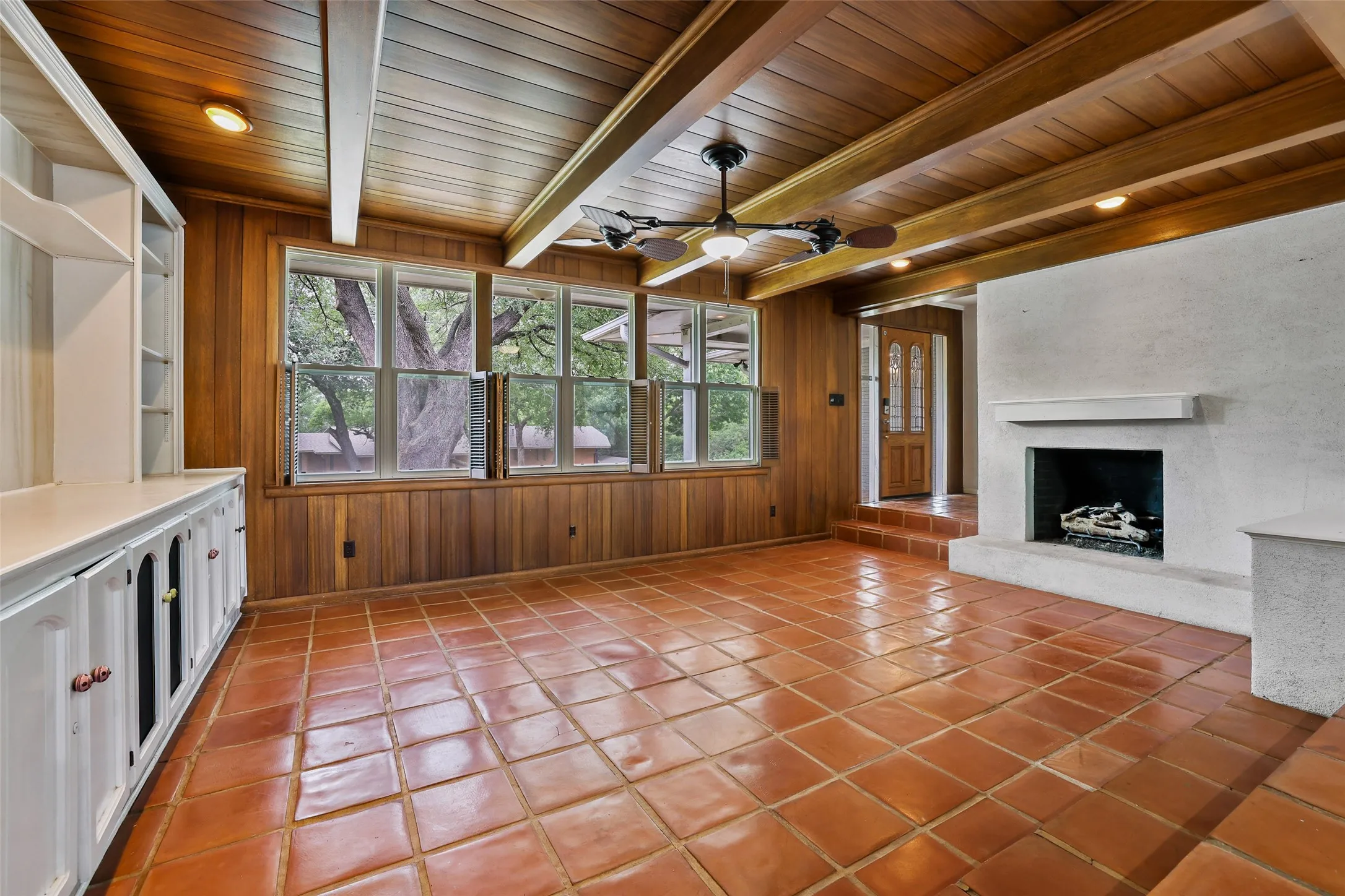 Large built-in and fireplace anchor the living area