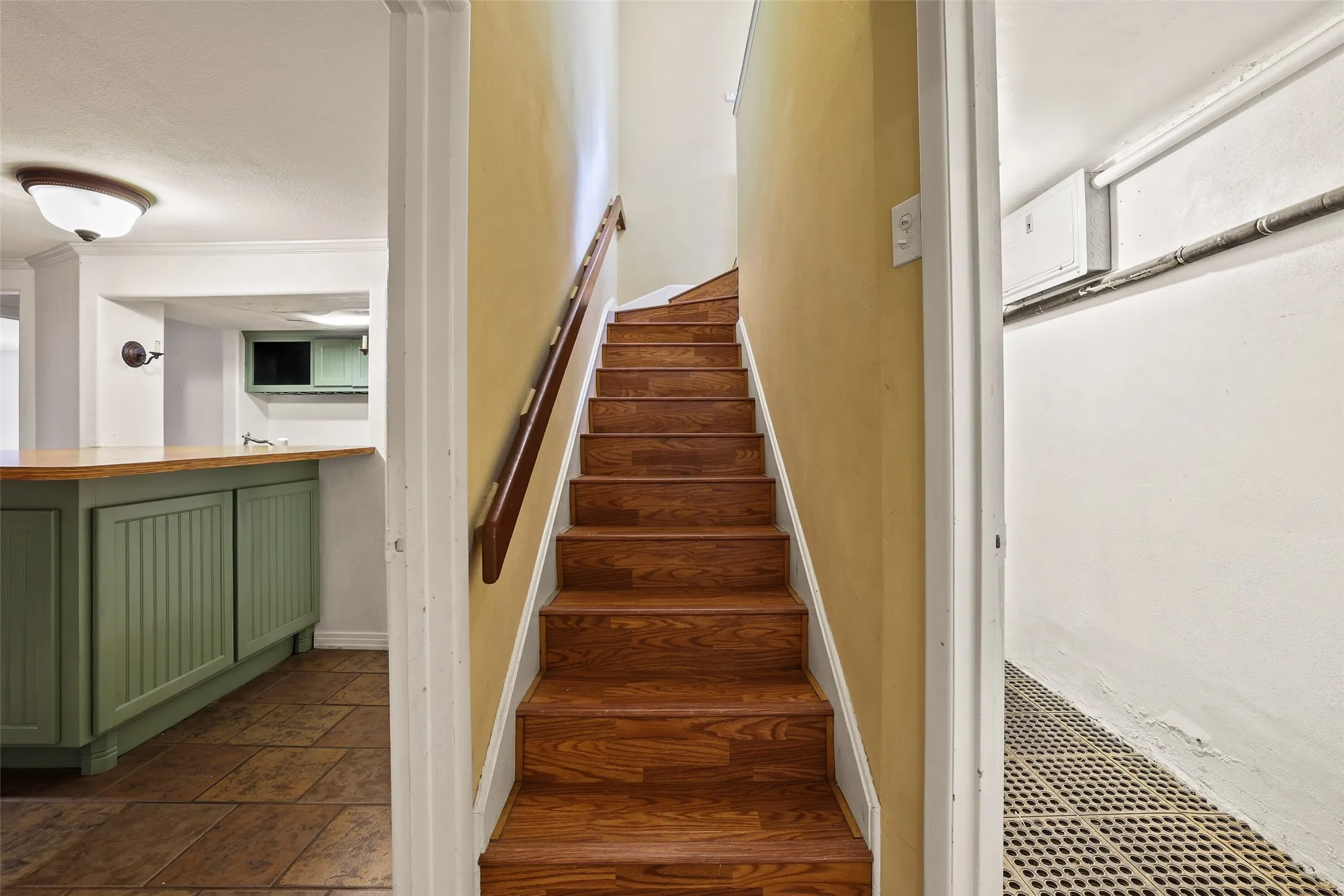 Stairs coming down to the basement