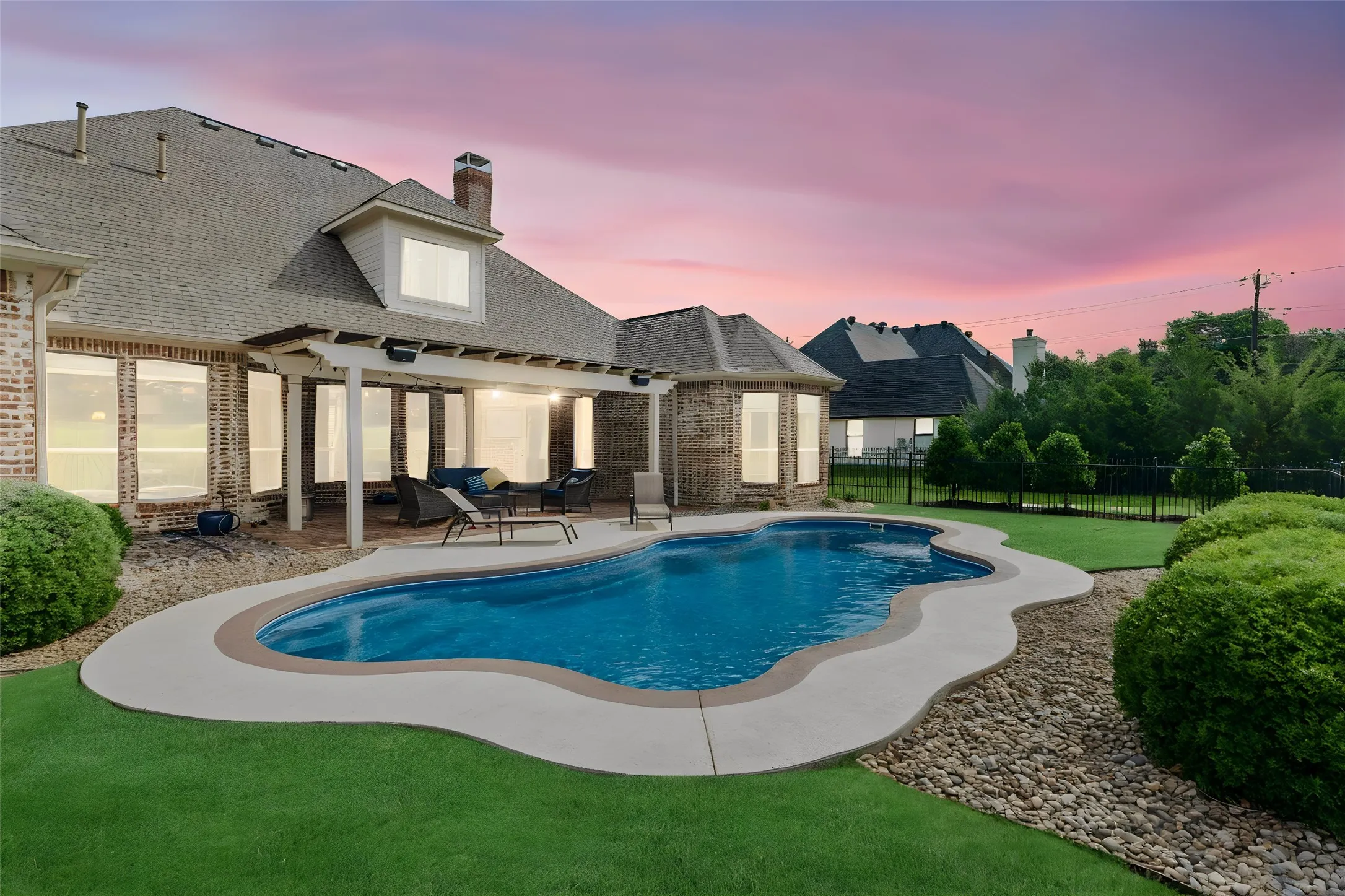 Sparkling Pool and Lush Landscaping