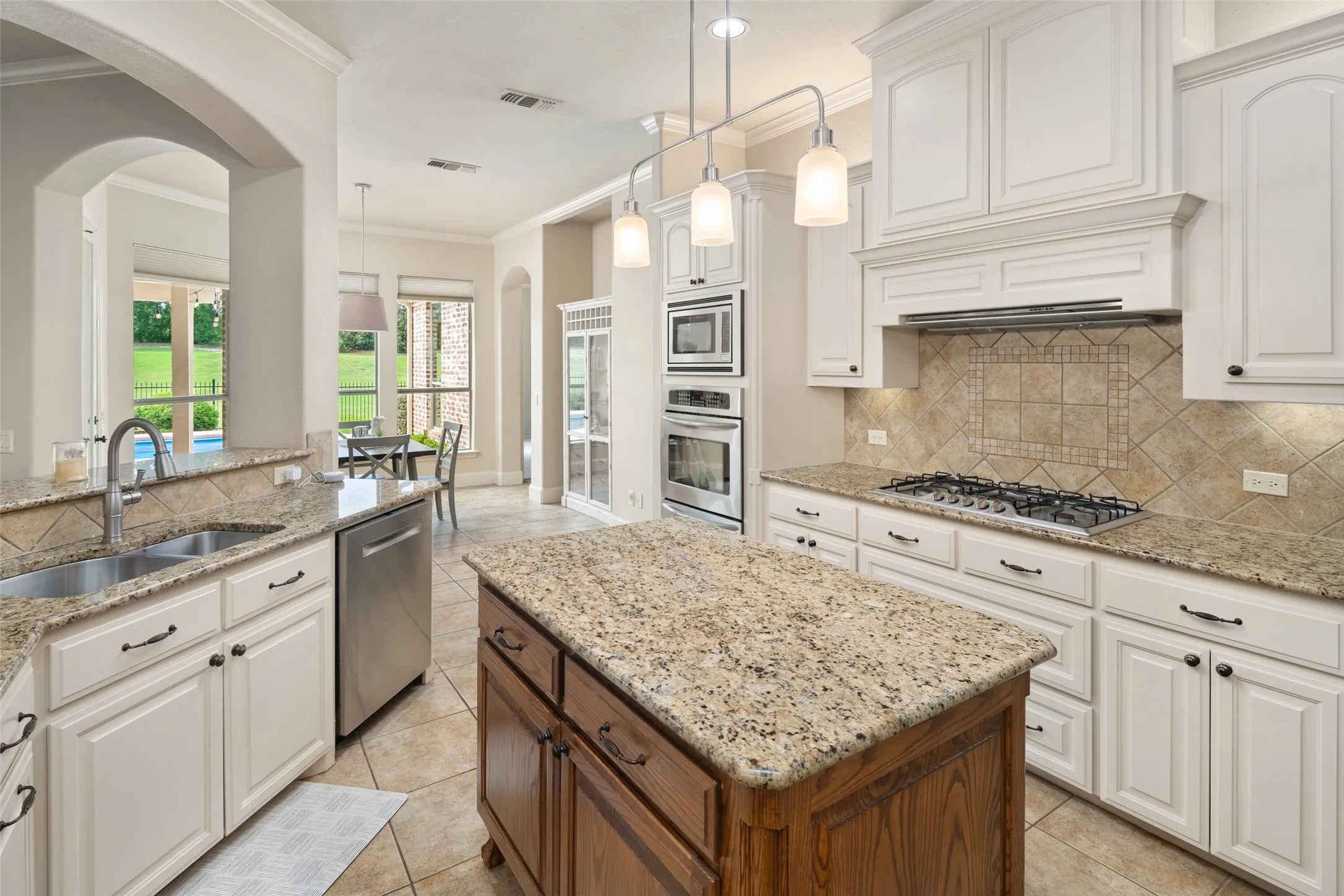 Double Ovens, Built in Microwave, Deep Sinks, Gas Cooktop, Vented Hood all creating a chef's dream workspace!
