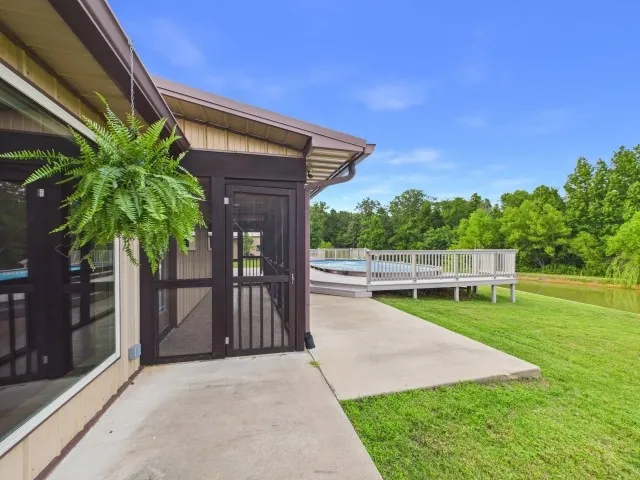 Screened in porch overlooking the pool & pond