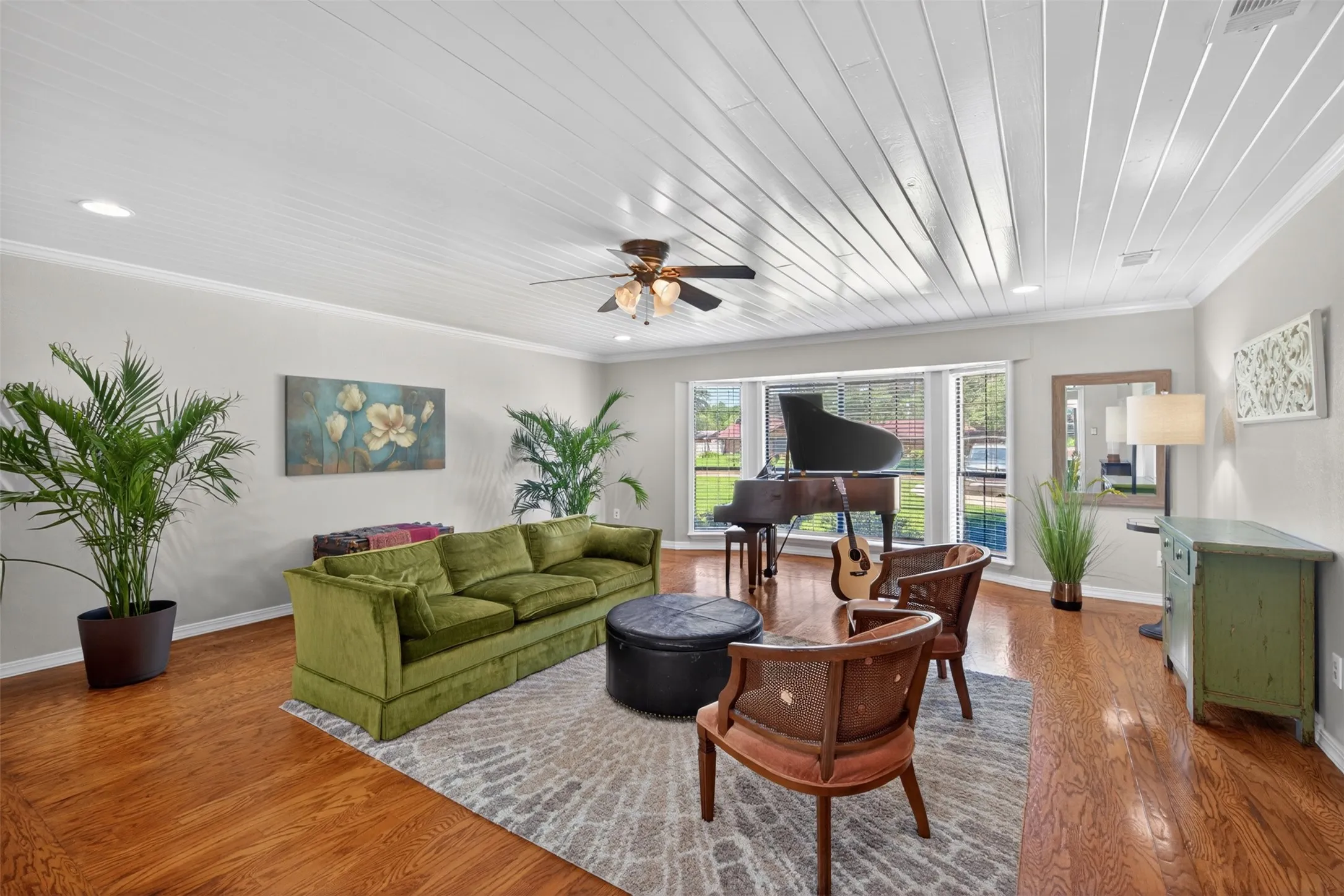 Living space featuring wood-finish flooring, a white plank ceiling, and recessed lighting