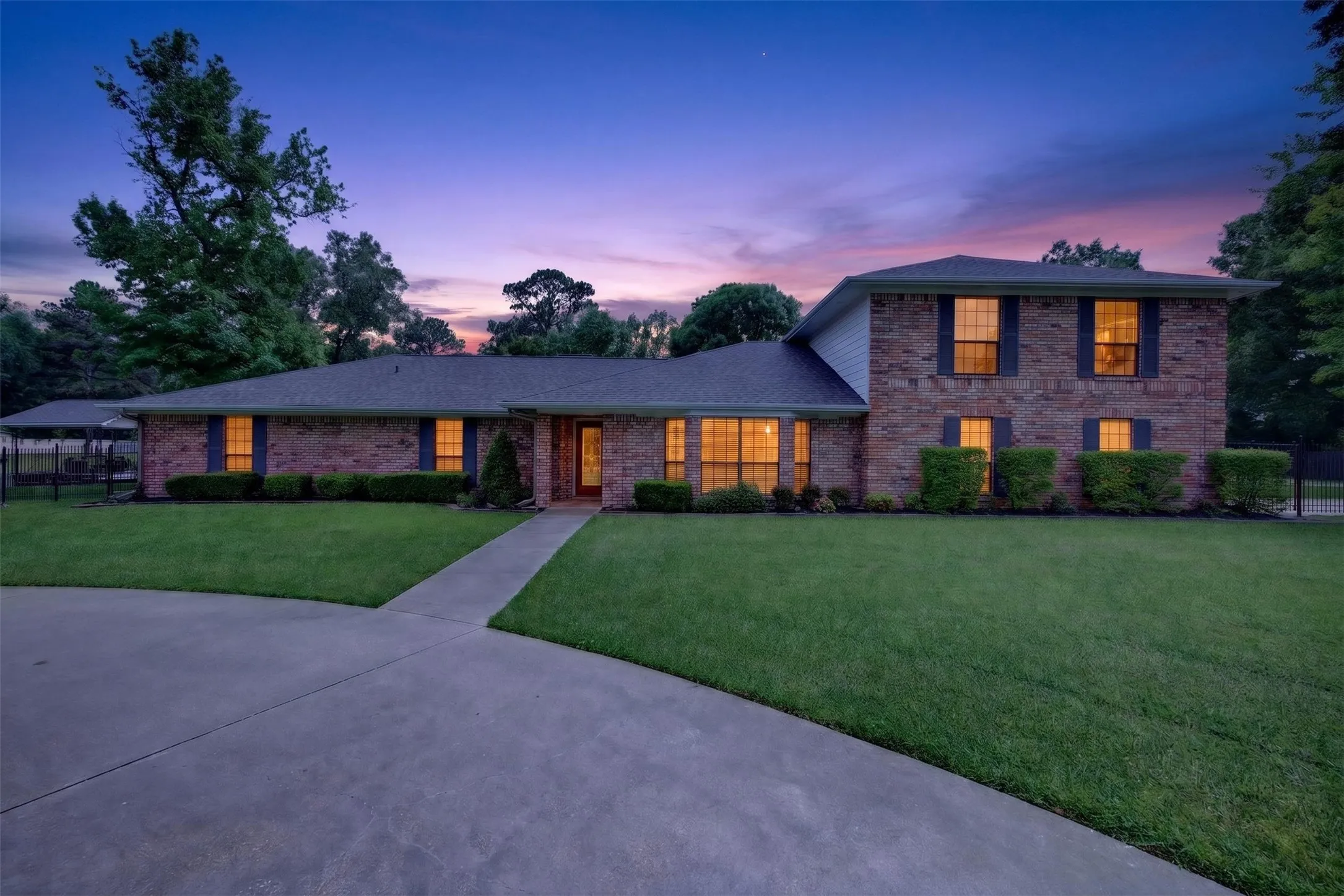 Brick exterior residence with a two-story section and a single-story section