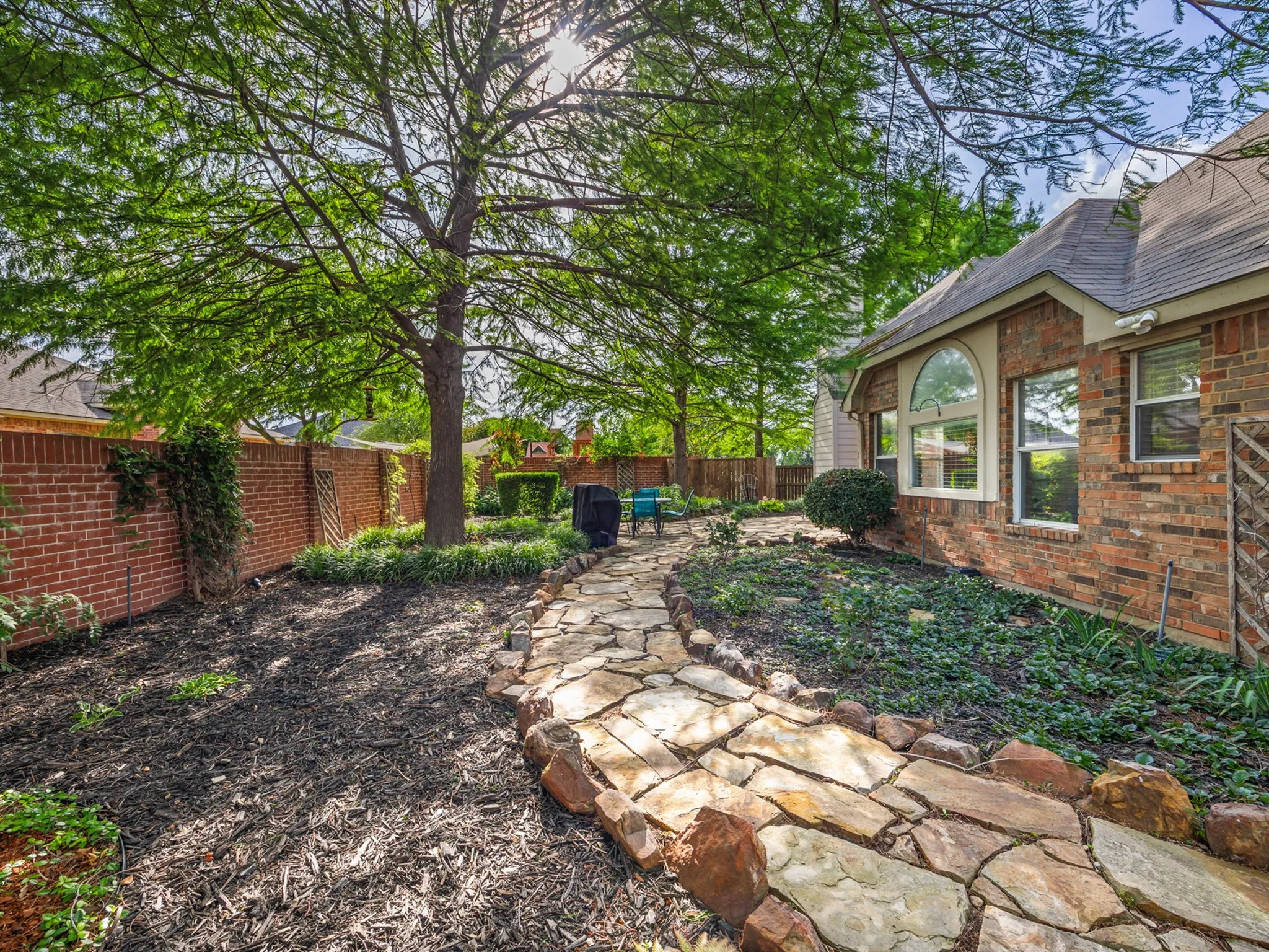 Exterior brick facade with an arched window accent