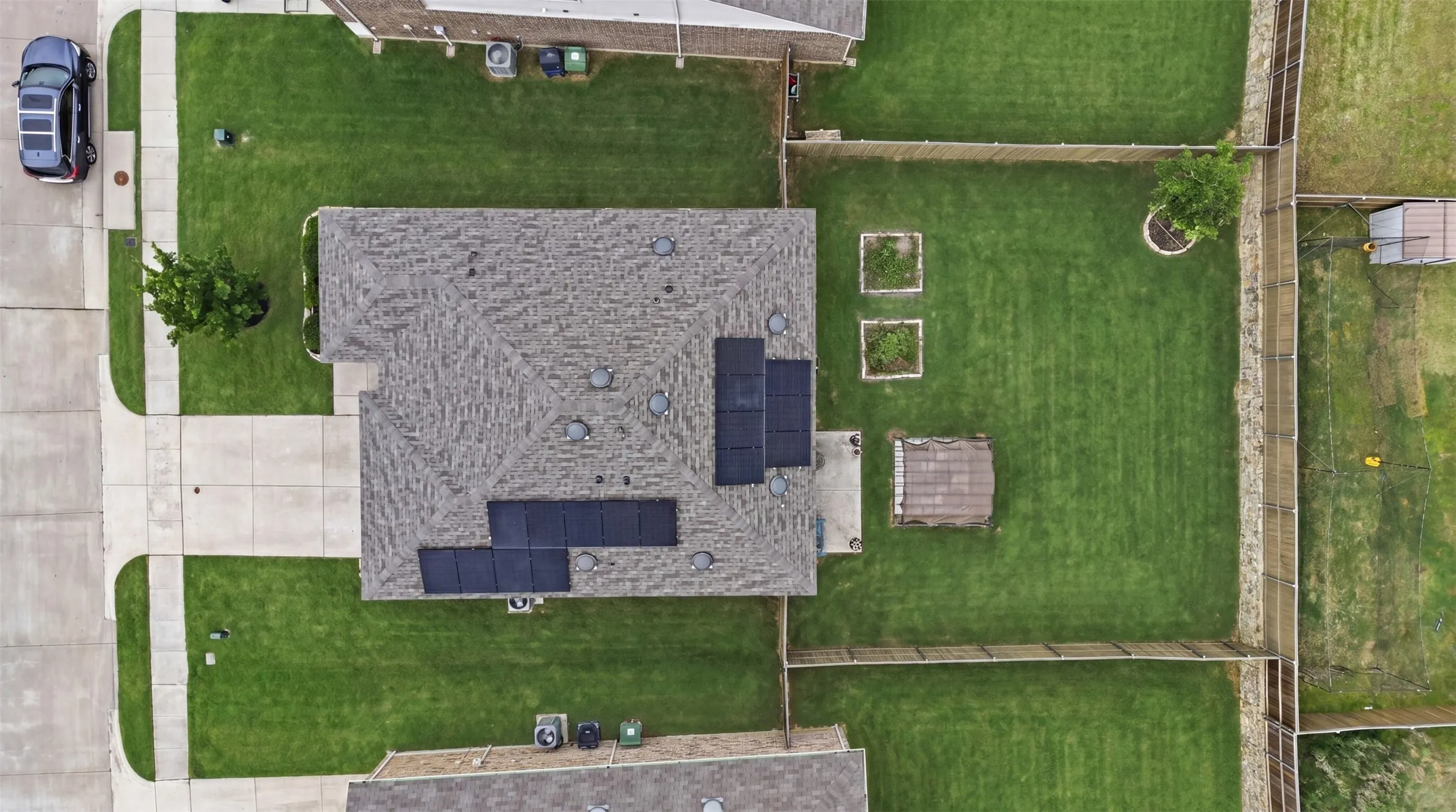 Asphalt shingle roof with integrated solar panel system