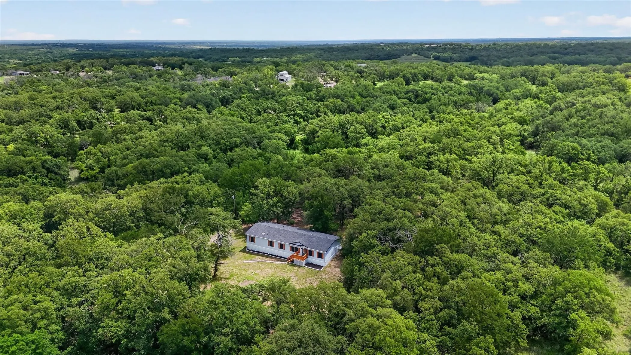 Single-story residence set amidst dense mature trees