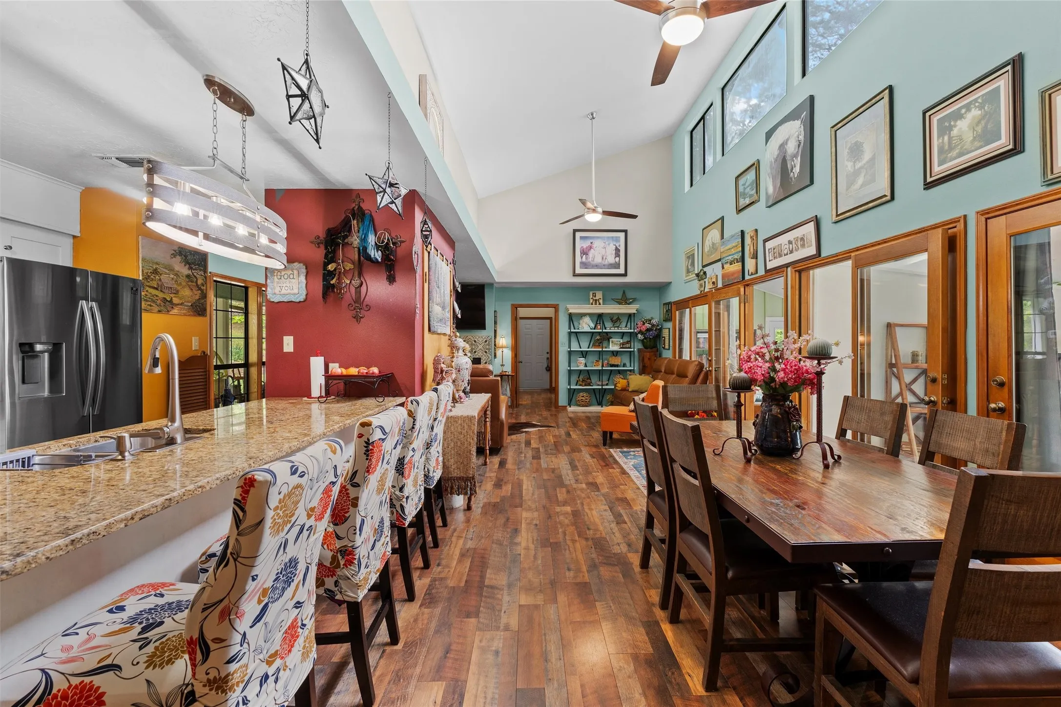 Expansive interior with vaulted ceilings and wood-finish flooring