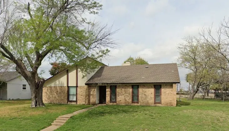 Brick and siding exterior with a pitched roof