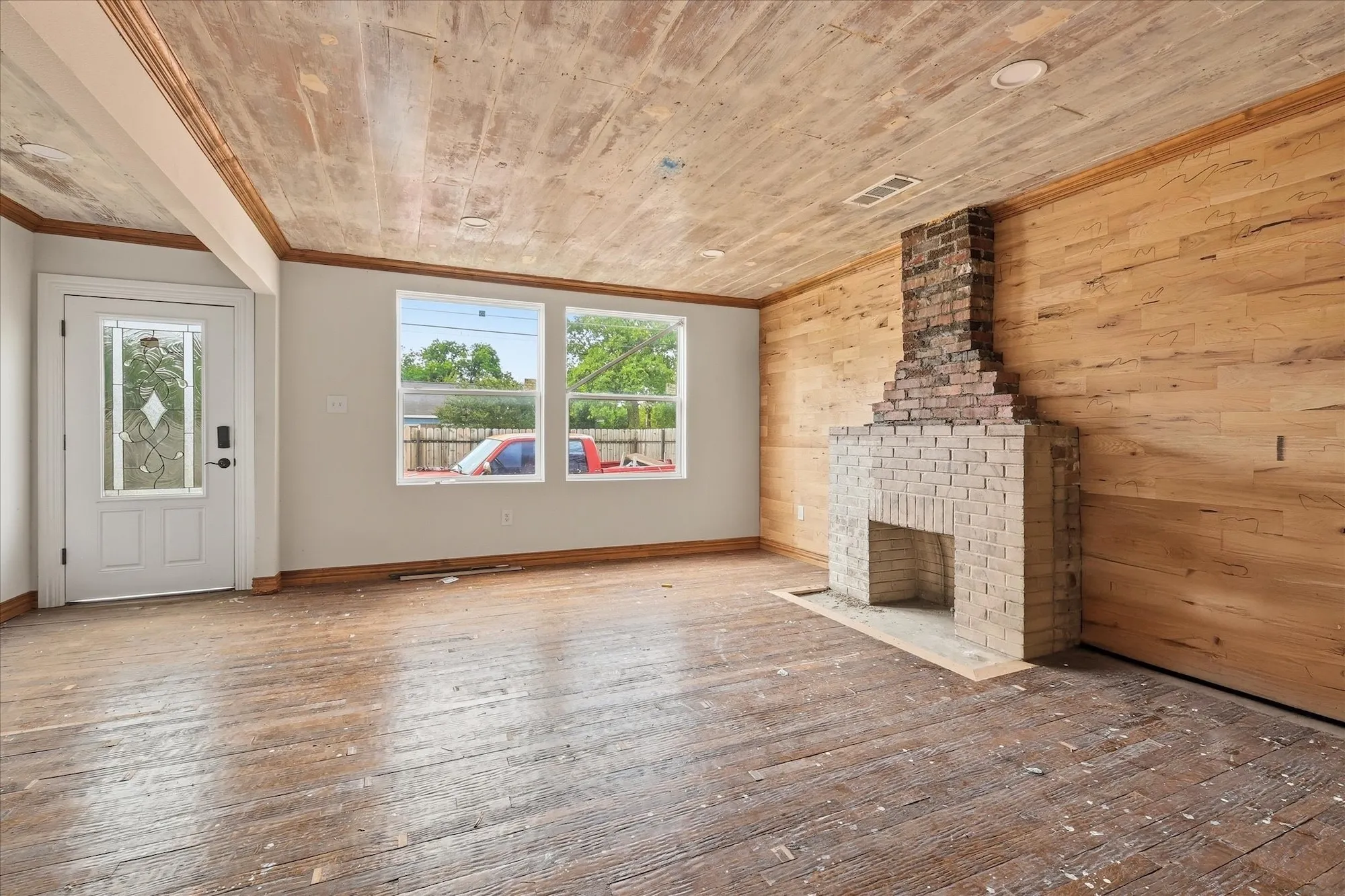 Brick fireplace feature with a light-colored brick hearth