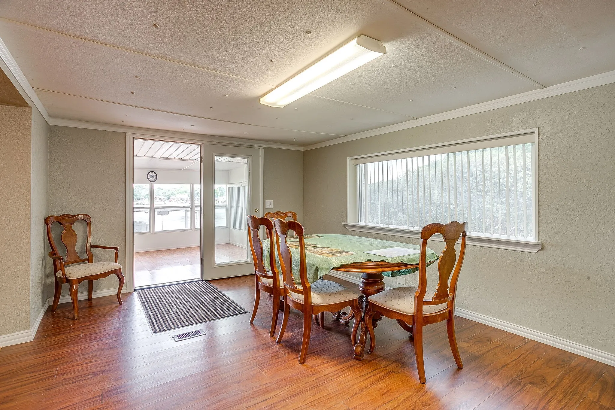 Wood-finish flooring throughout, with a large window providing ample natural light