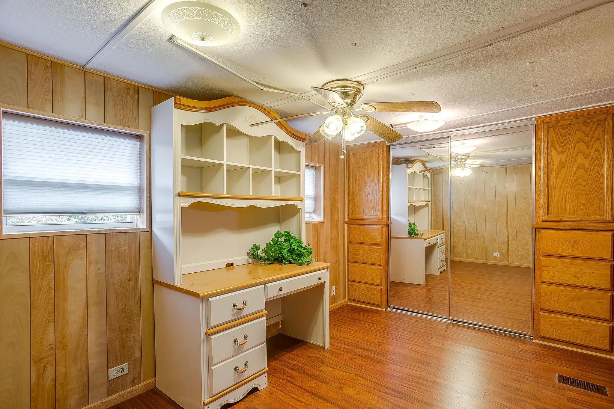 Room featuring wood-finish paneling and wood-finish flooring